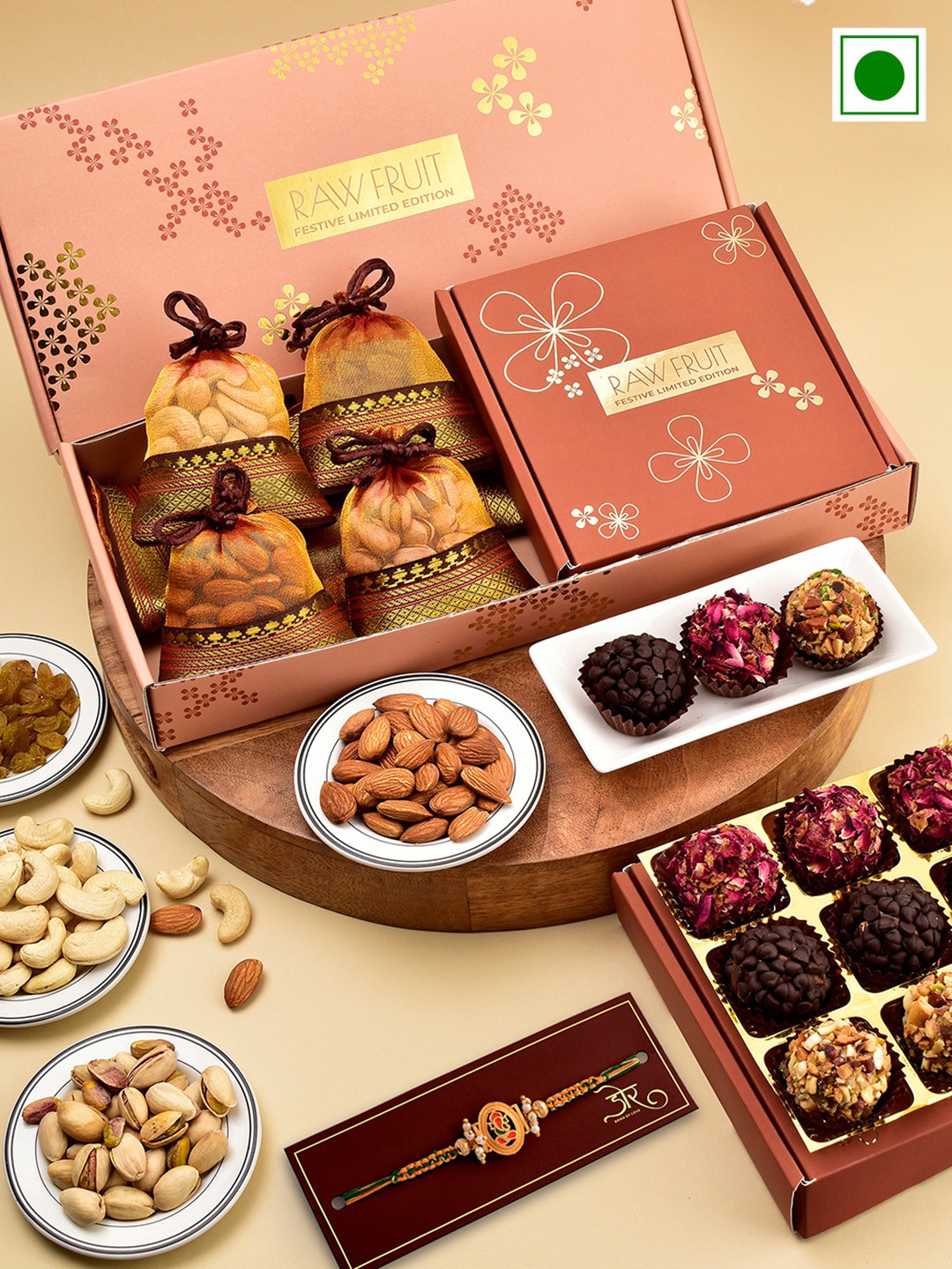 

RawFruit Ganesh Charm Beaded Rakhi With Dryfruits & Laddoo Sweets Gift Set 75 gms Each, Orange