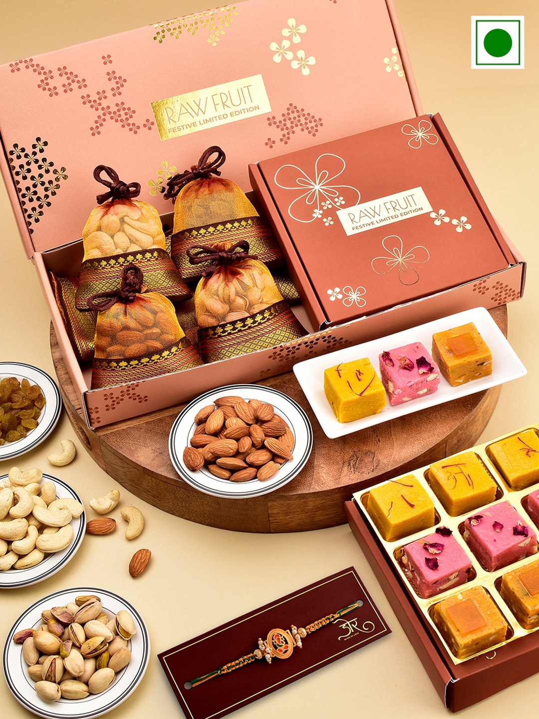 

RawFruit Ganesh Charm Rakhi With Sweets & Dryfruits Gift Set, Orange