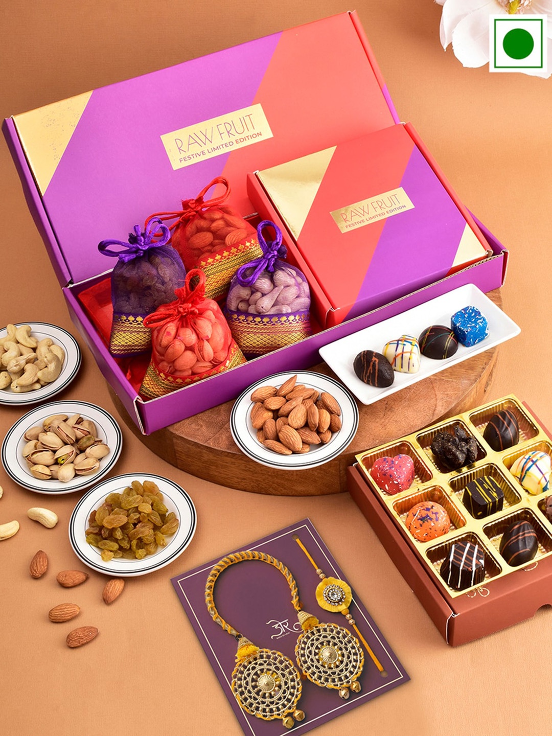 

RawFruit Set Of 2 Bhaiya Bhabhi Rakhis With Roli Chawal, Chocolate & Dryfruit Gift Set, Gold