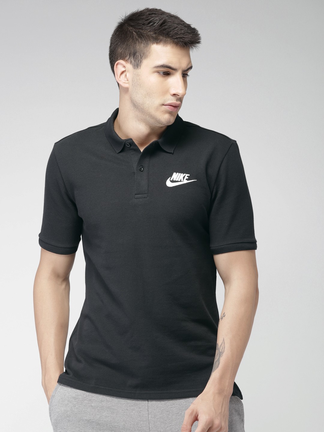 

Nike Men Black Solid Polo Collar Pure Cotton T-shirt