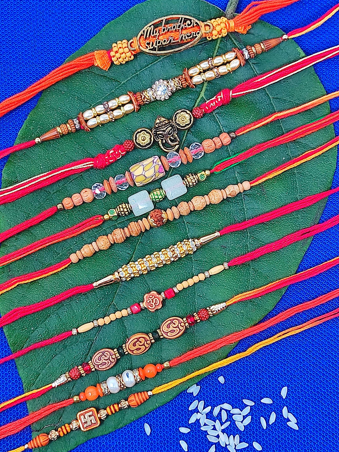 

CRAYTON Set Of 11 Beaded & Ganesha Charm Rakhi, Red