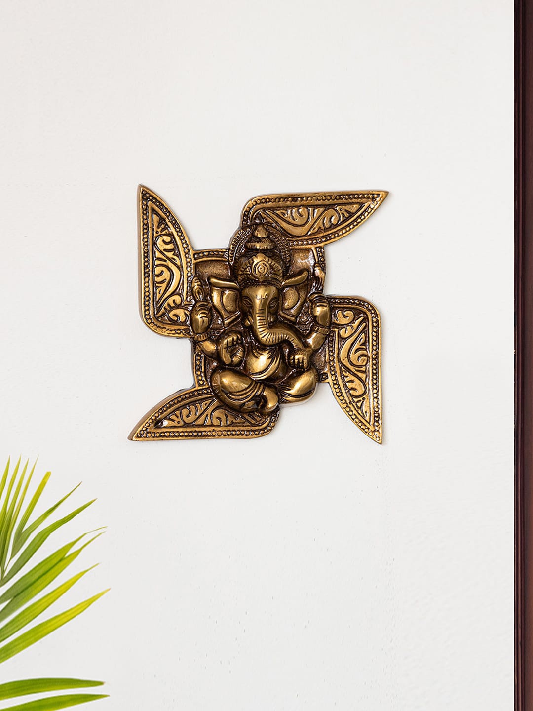

ExclusiveLane Yellow Textured Swastik Ganesha Brass Spiritual Wall Decor, Gold