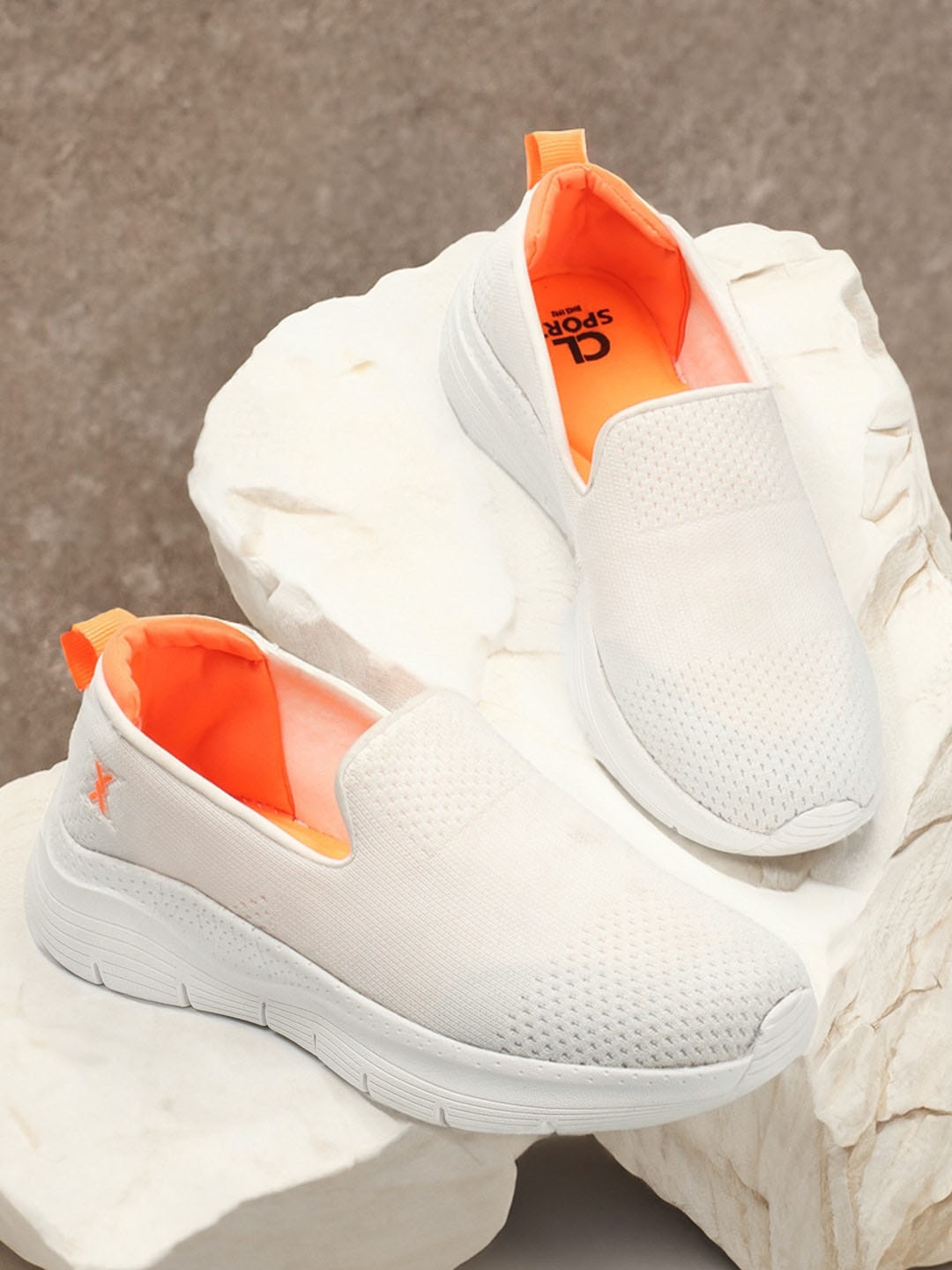 

Carlton London sports Women Textured Lightweight Mesh Basics Slip-On Sneakers, White