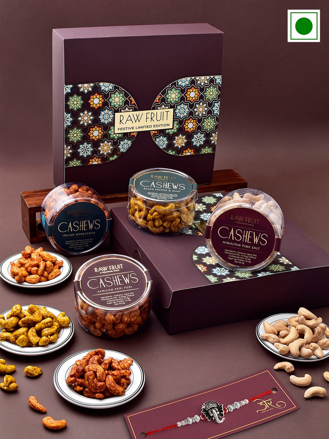 

RawFruit Ganesha charm Rakhi With Roli Chawal & Roasted Cashew Gift Set, Silver