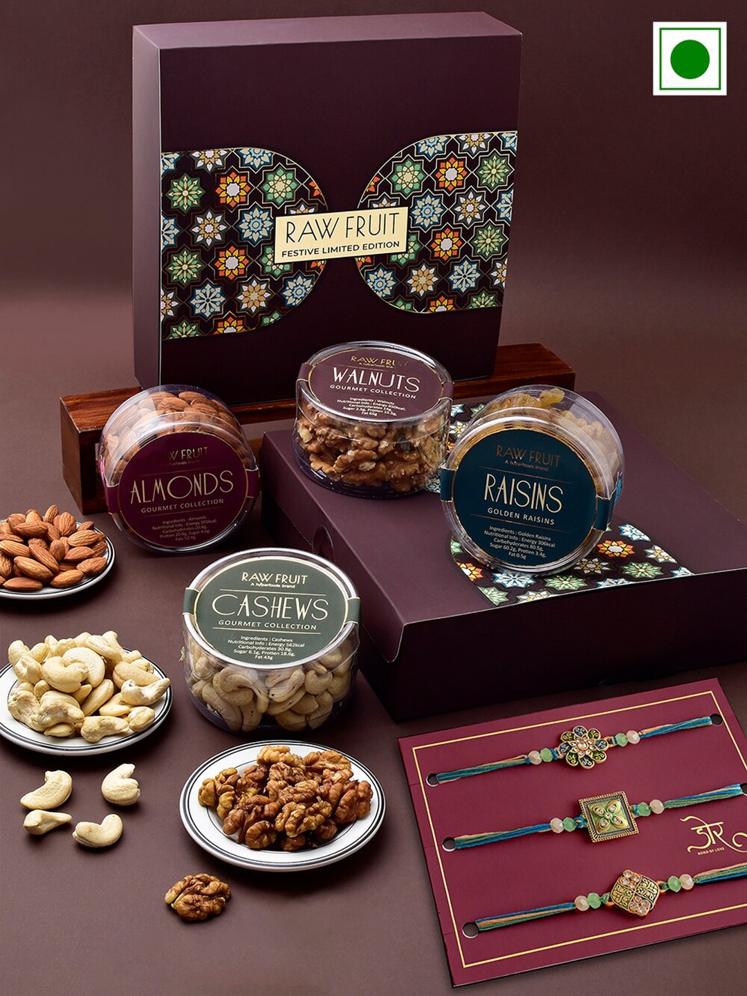 

RawFruit Set Of 7 Stone studded Rakhi With Roli Chawal & Nuts Gift Set, Blue