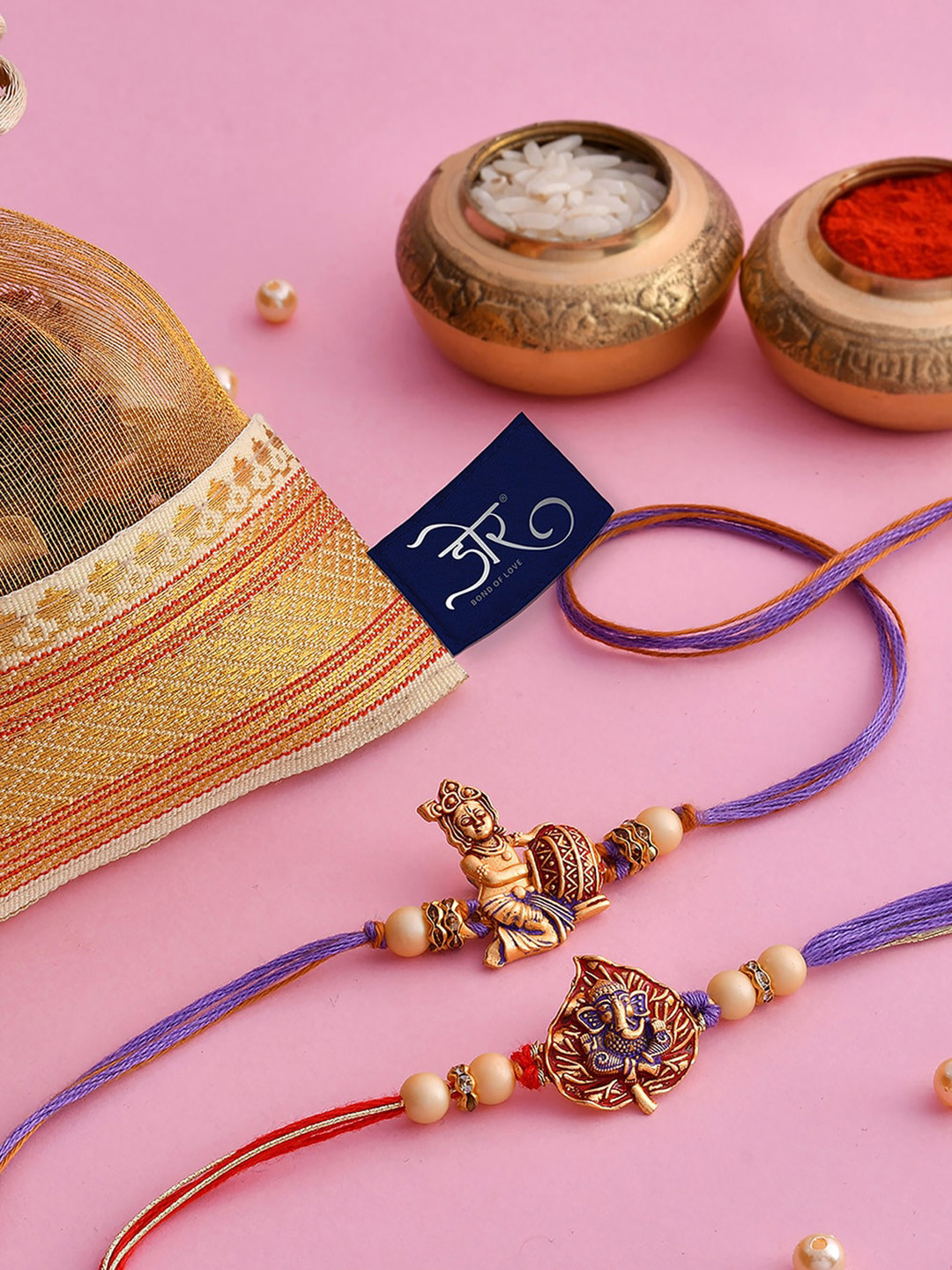 

RawFruit Set Of 2 Ganesh & Krishna Beaded Rakhi With Cashew Almond Pista 325g, Gold