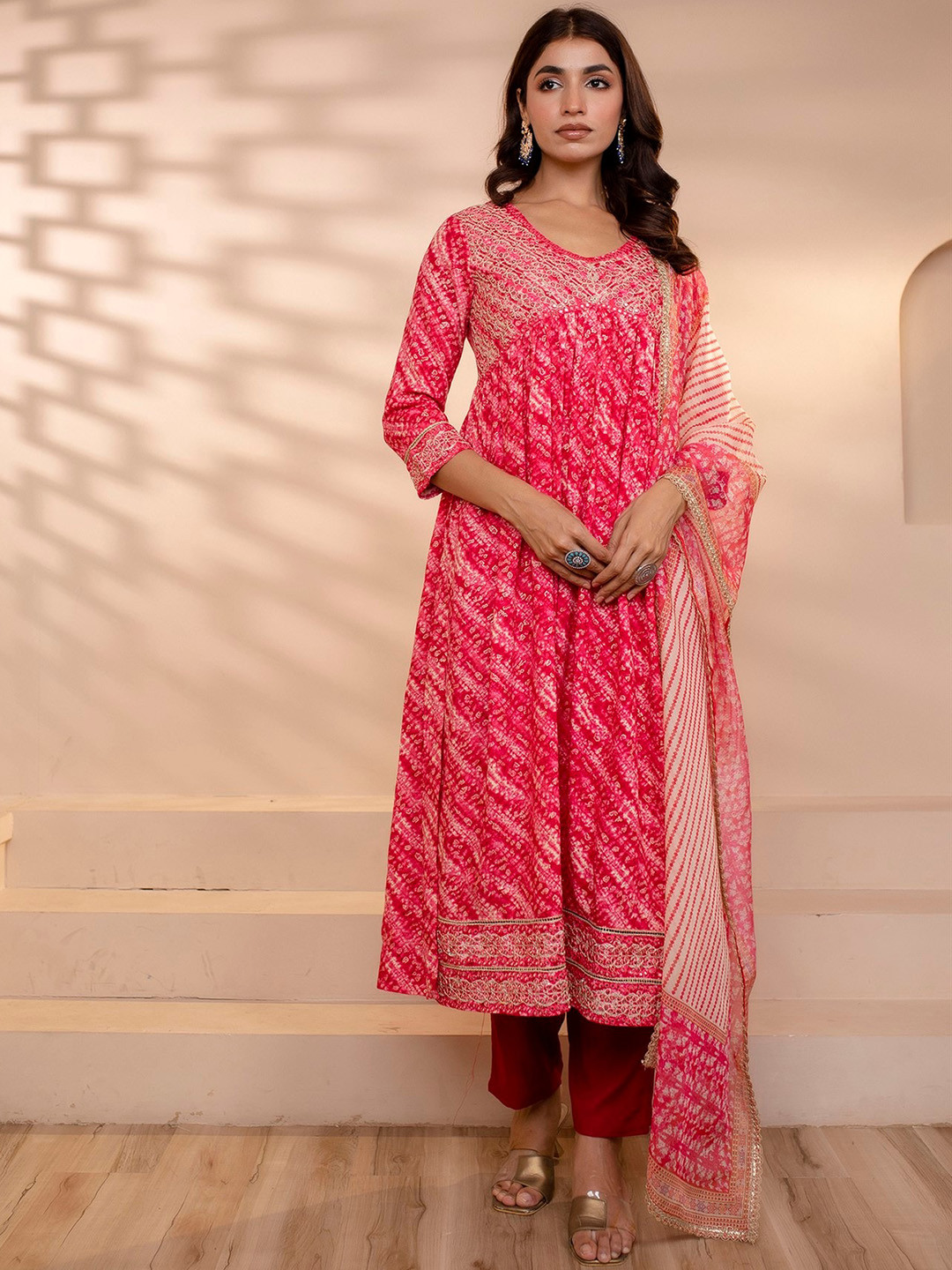 

Nehamta Ethnic Motifs Printed Empire Mirror Work Kurta With Trousers & Dupatta, Pink