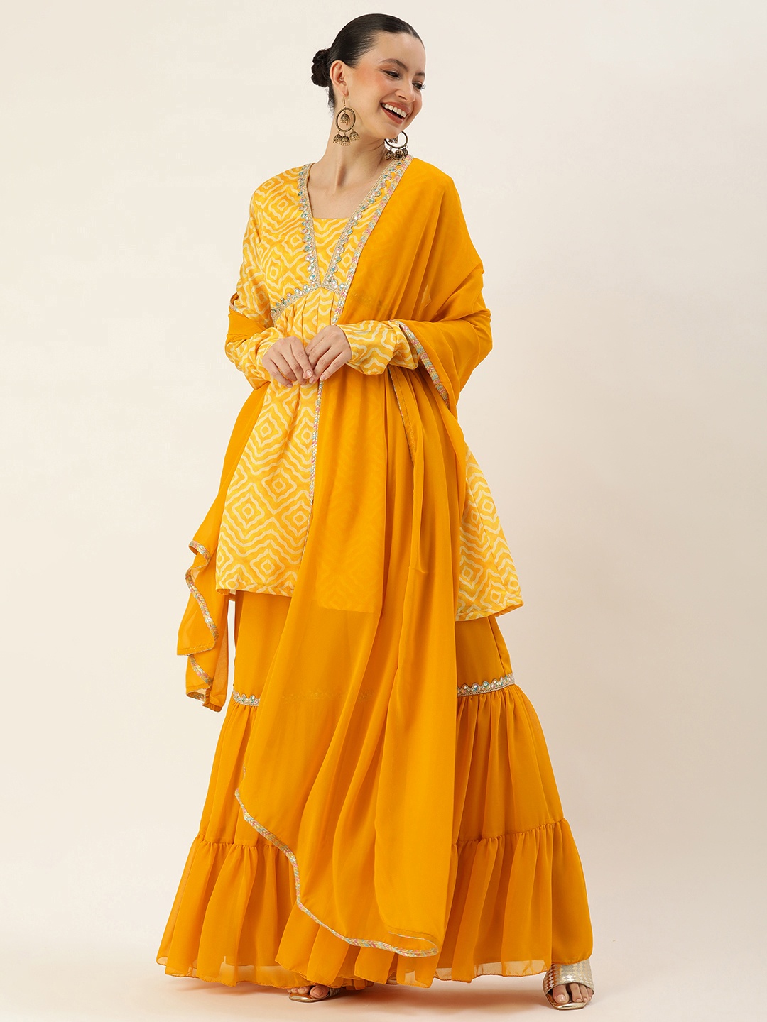 

Ethnovog Women Printed Pleated Thread Work Kurti with Sharara & With Dupatta, Yellow