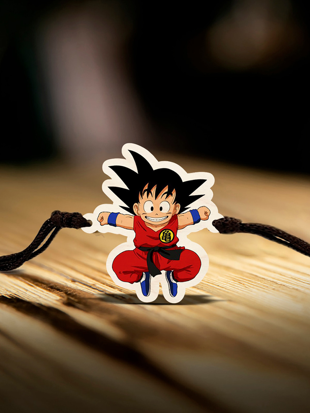 

Bigsmall Goku Charm Thread Rakhi, Brown