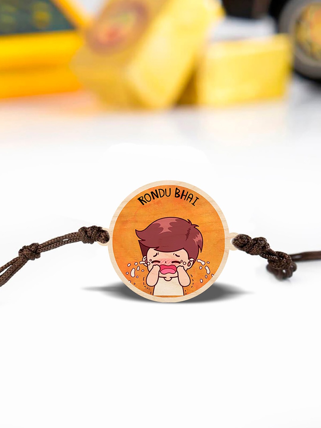 

Bigsmall Rondu Bhai Wooden Charm Rakhi, Yellow