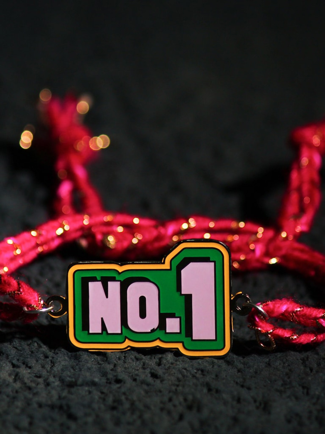 

Bigsmall No.1 Metal Charm Rakhi, Purple