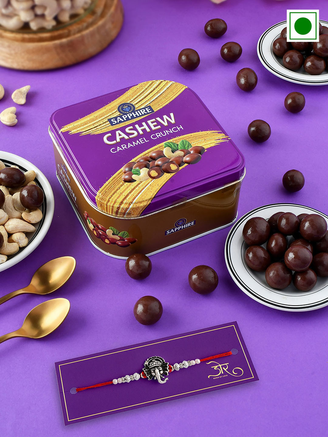 

Hyperfoods Ganesha Rakhi With Sapphire Cashew Chocolate Gift Set 90 g, Red