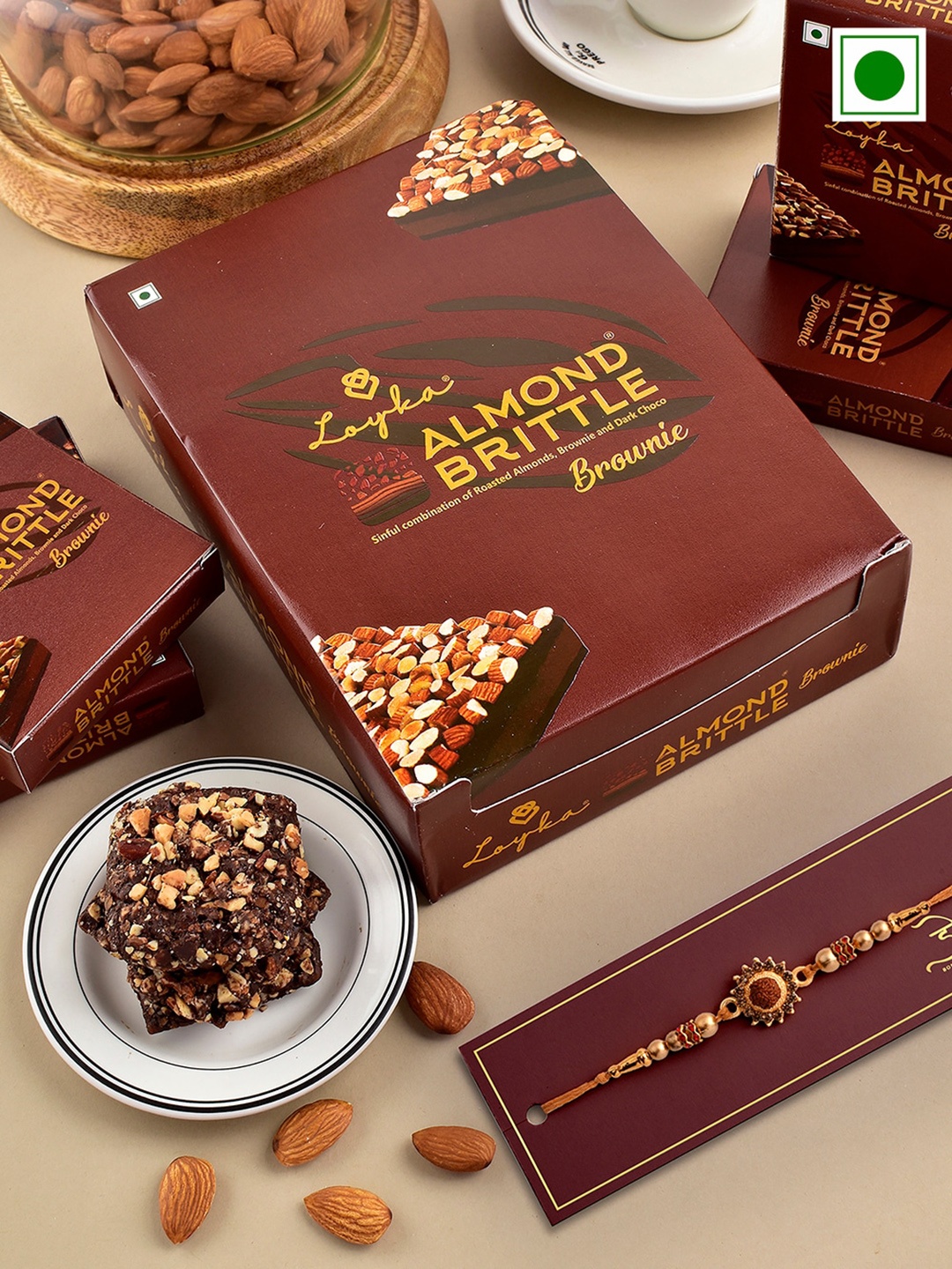 

Hyperfoods Rudraksh Beaded Rakhi With Loyka Almond Brittle Brownie Chocolate Gifts 204 g, Brown