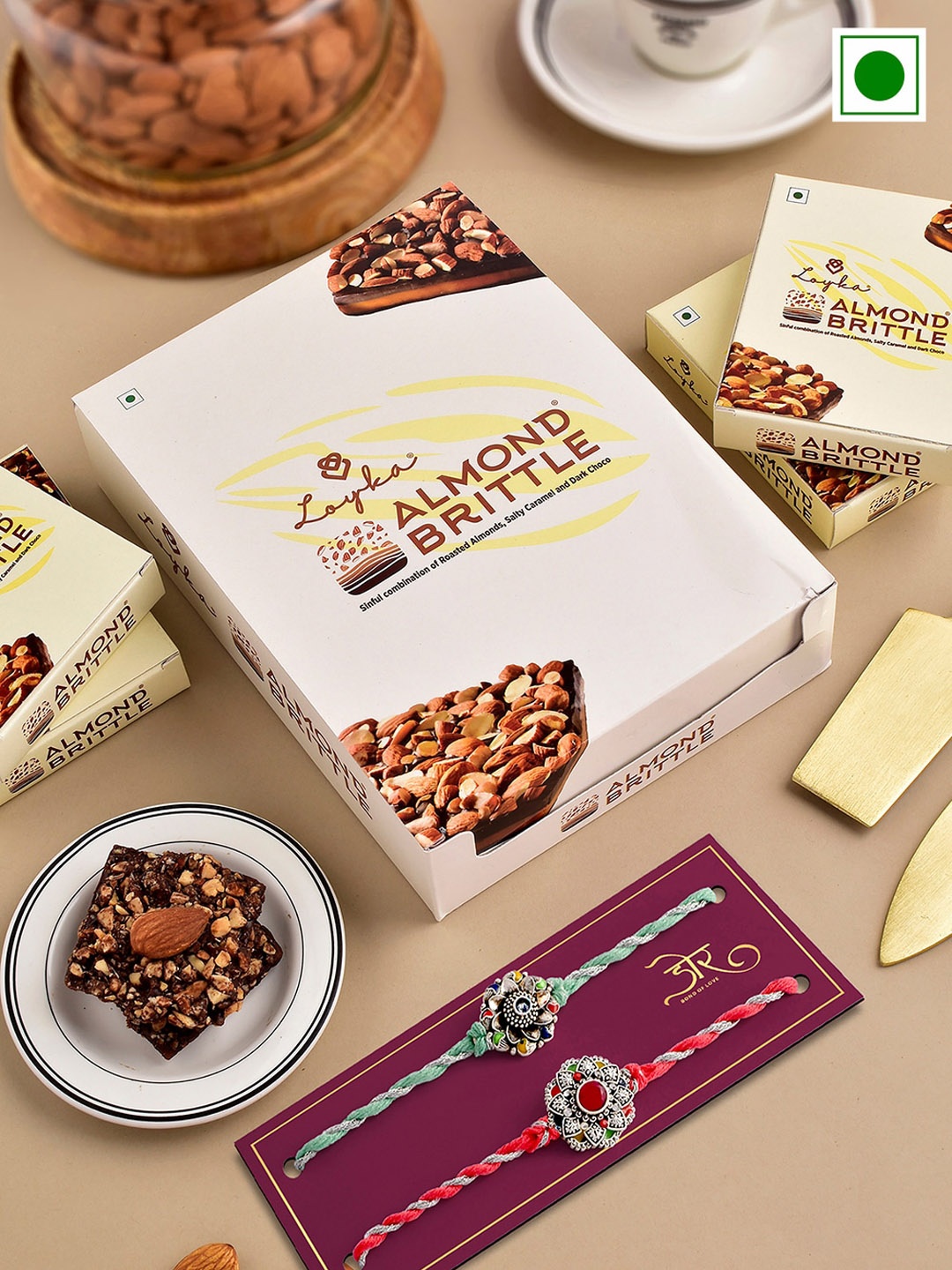

Hyperfoods Set Of 2 Rakhi With Loyka Almond Brittle Chocolate Gift Set 204 gm, Red