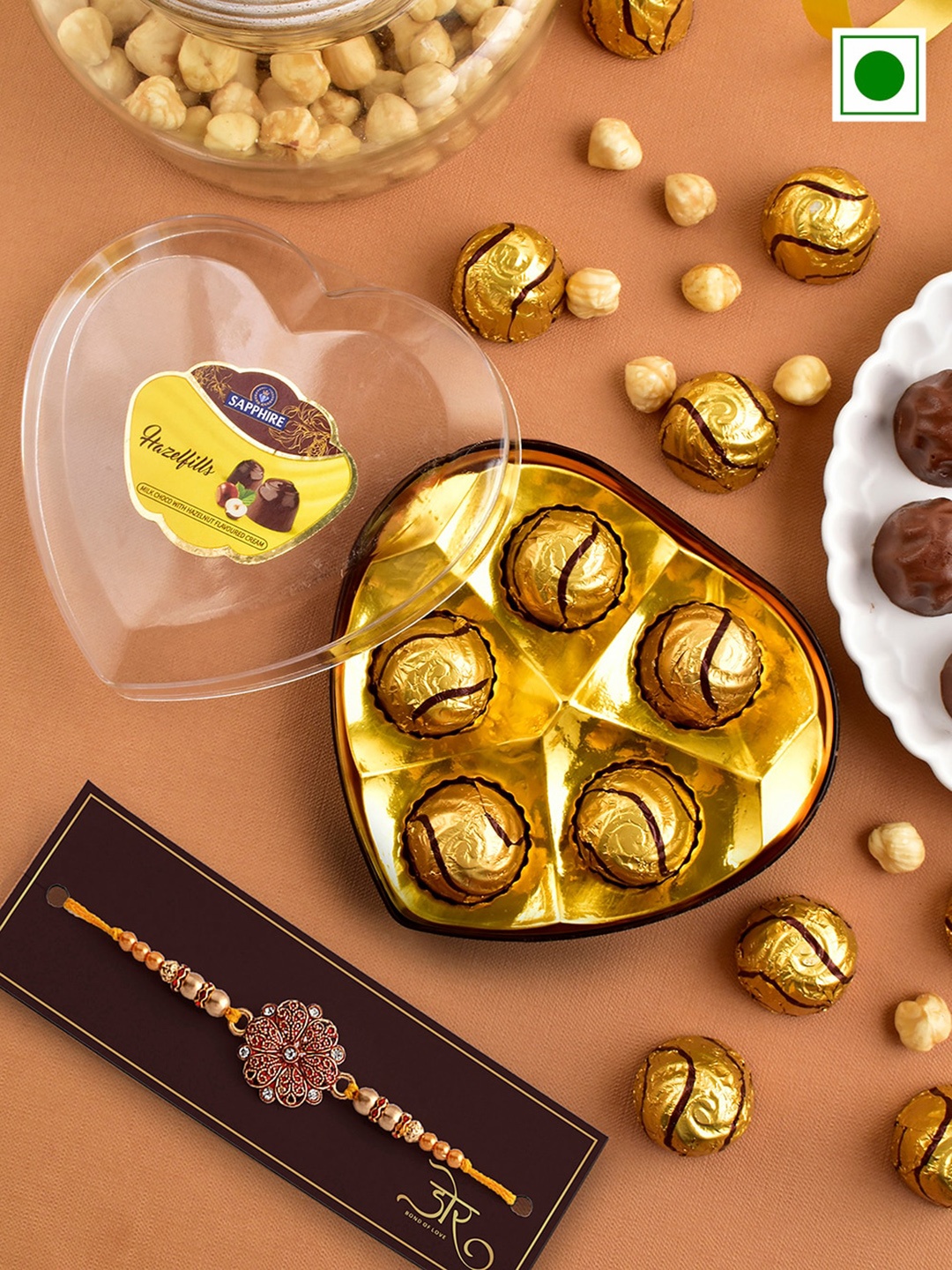 

Hyperfoods Flower Charm Stone-Studded Rakhi With Sapphire Hazelfills Chocolates, Gold
