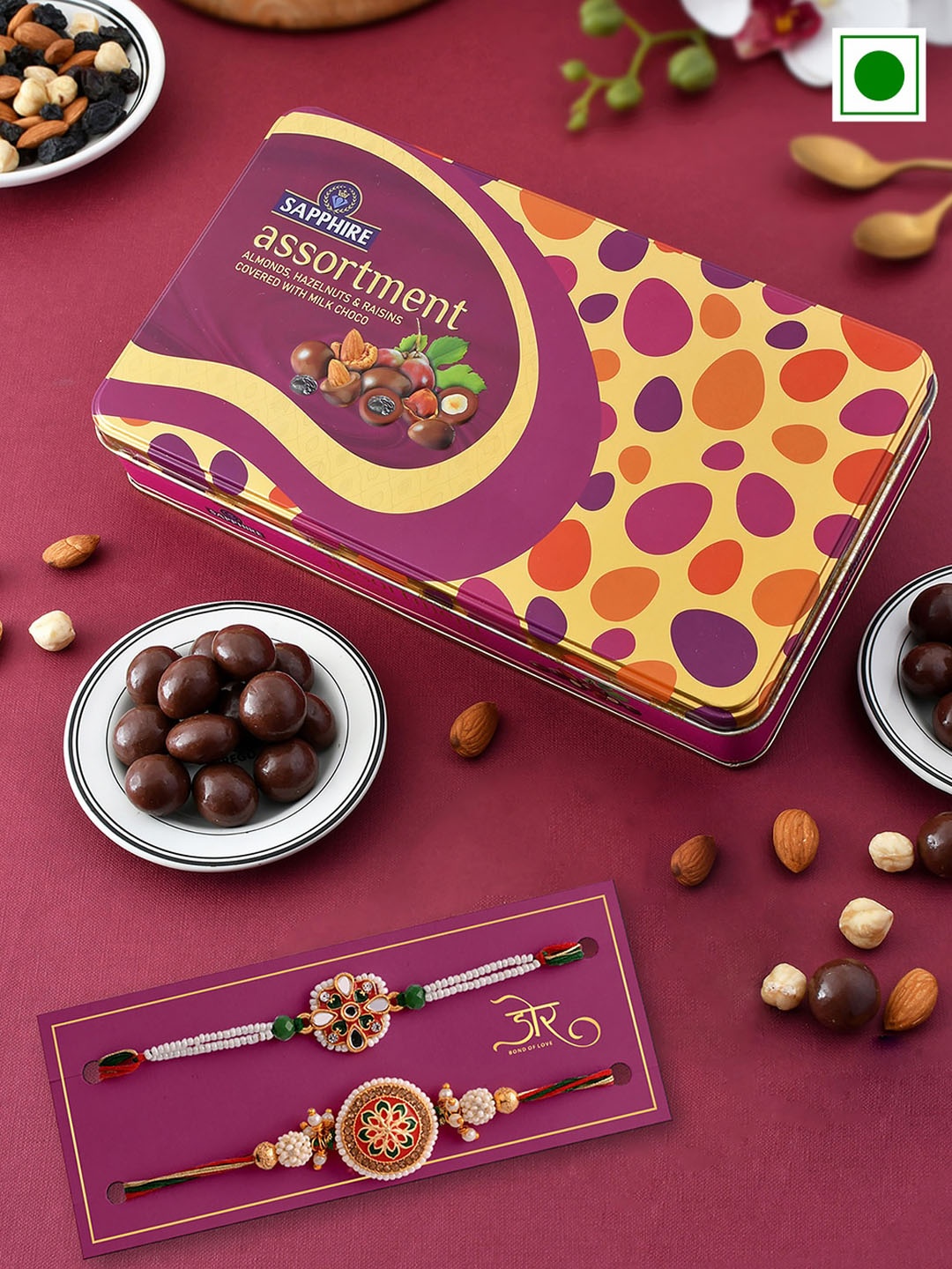 

Hyperfoods Set Of 2 Stone-Studded Rakhis With Sapphire Chocolate Coated Fruits Set, Purple