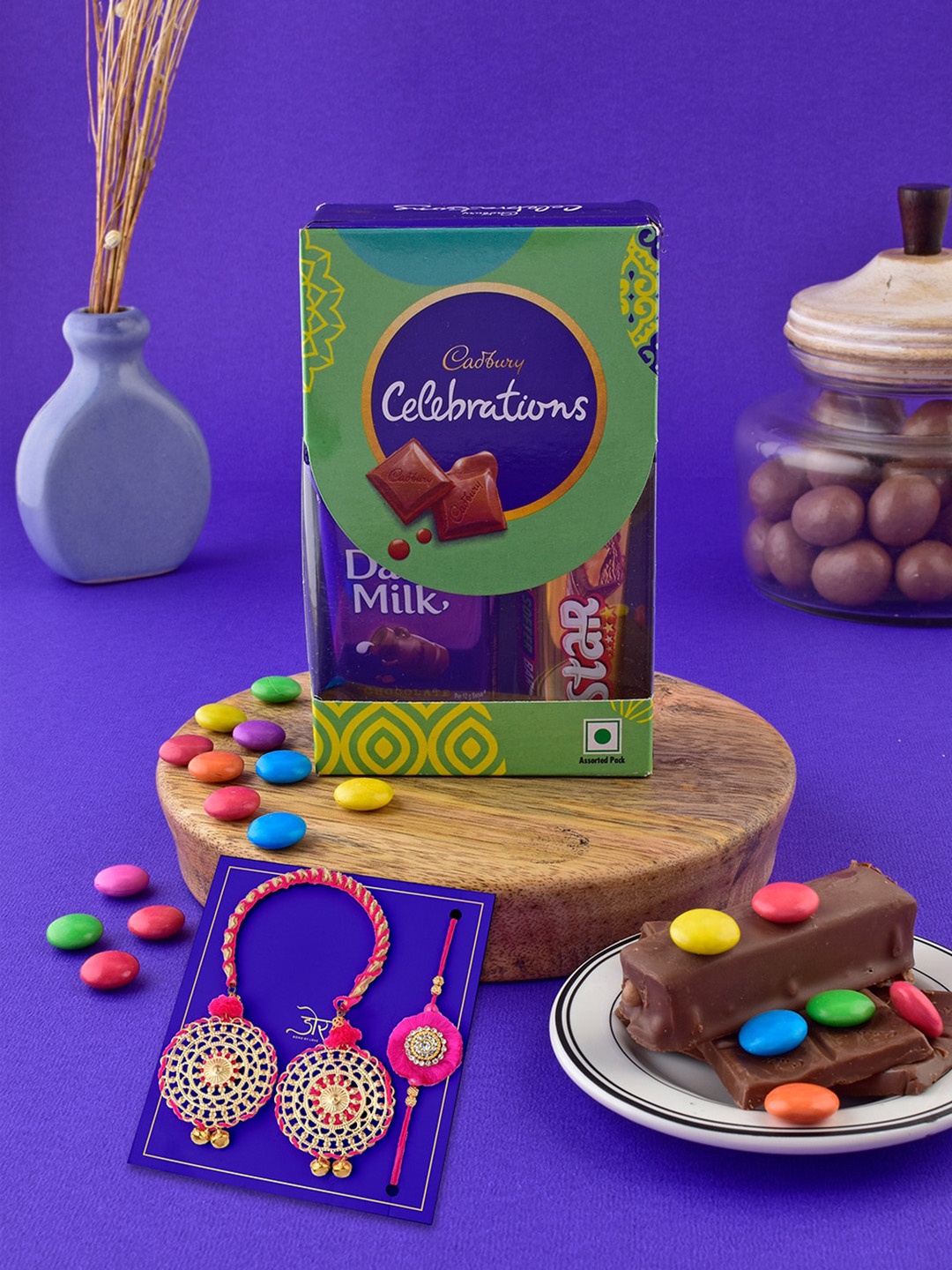 

Hyperfoods Set Of 2 Bhai Bhabhi Rakhis With Cadbury Celebrations Chocolate 59.8gms, Pink