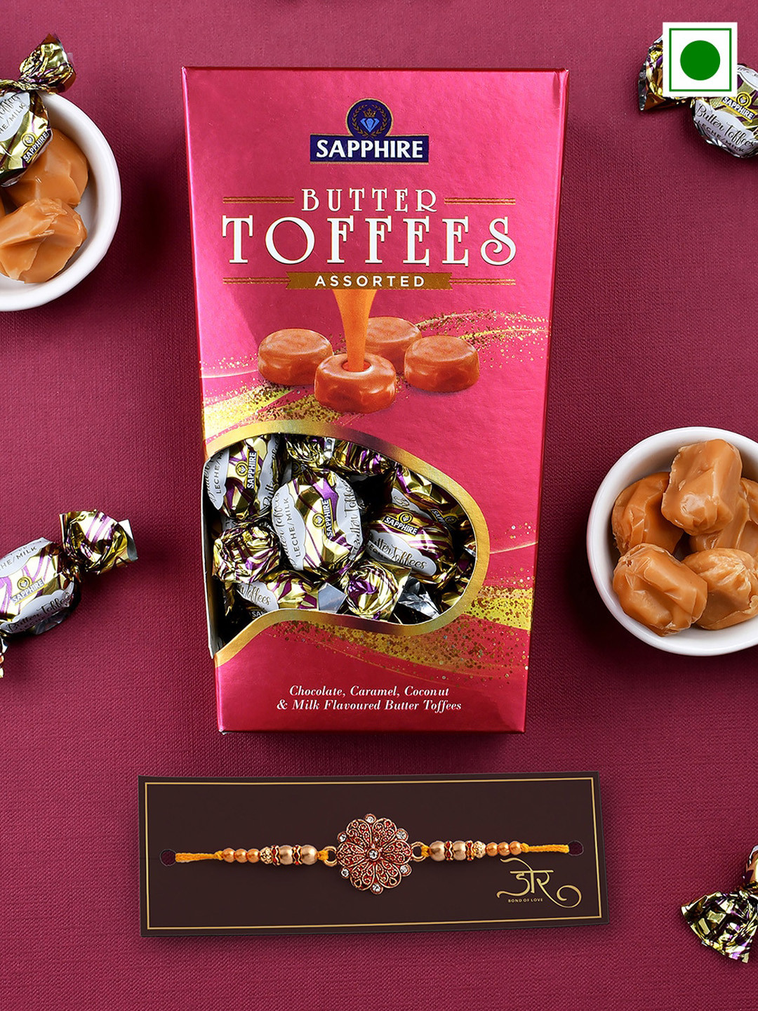 

Hyperfoods Stone-Studded Rakhi With Sapphire Butter Toffees Set, Pink