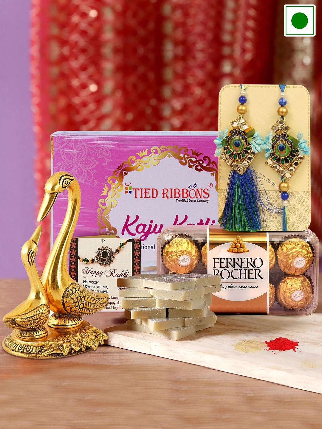 

TIED RIBBONS Set Of 4 Lumba Rakhi With Sweets Chocolates & Statue Gift Pack, Multi