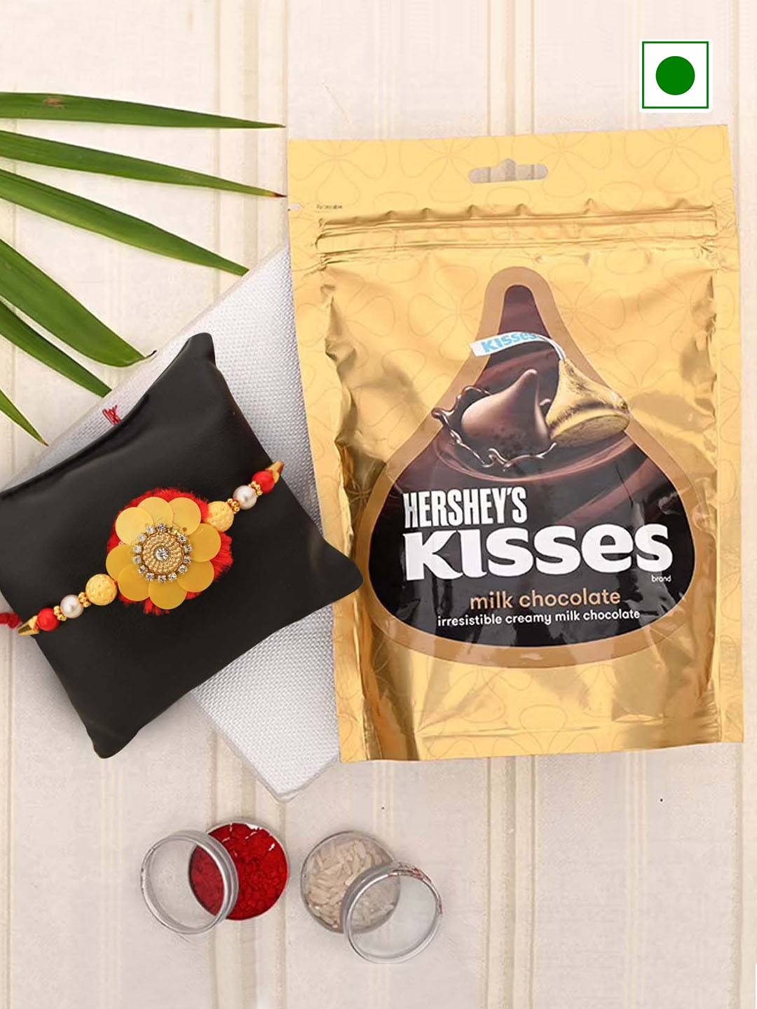 

TIED RIBBONS Studded Stones & Beaded Floral Rakhi With Hersheys Kisses Chocolate Set 36g, Red