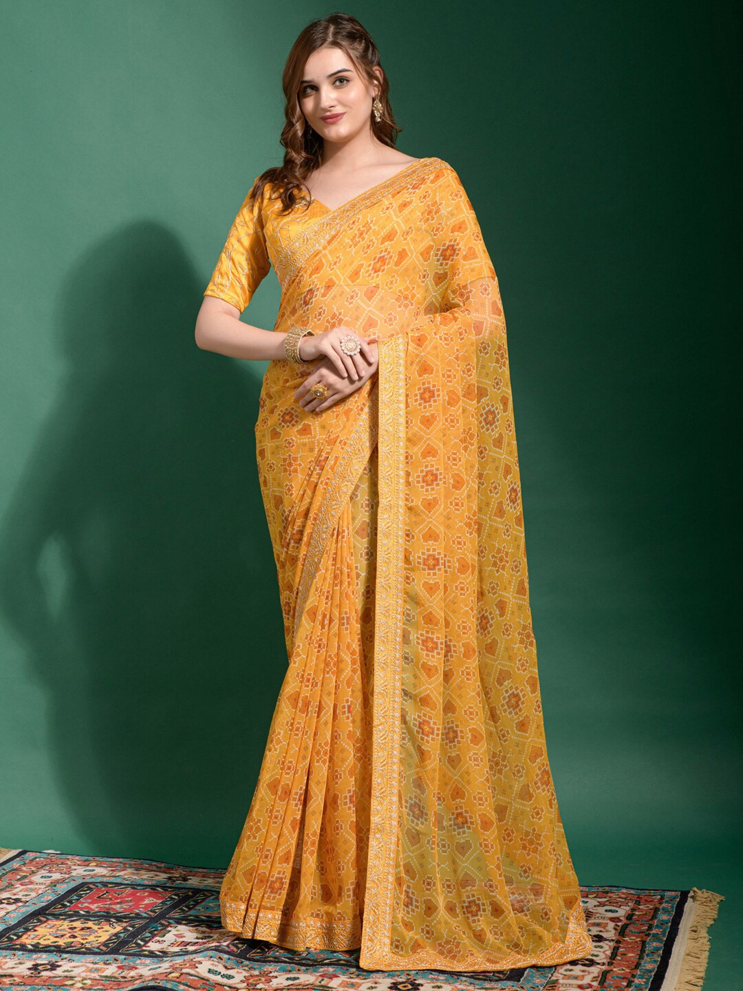

Anouk Yellow & Red Ethnic Motifs Printed Sequined Pure Georgette Ikat Saree
