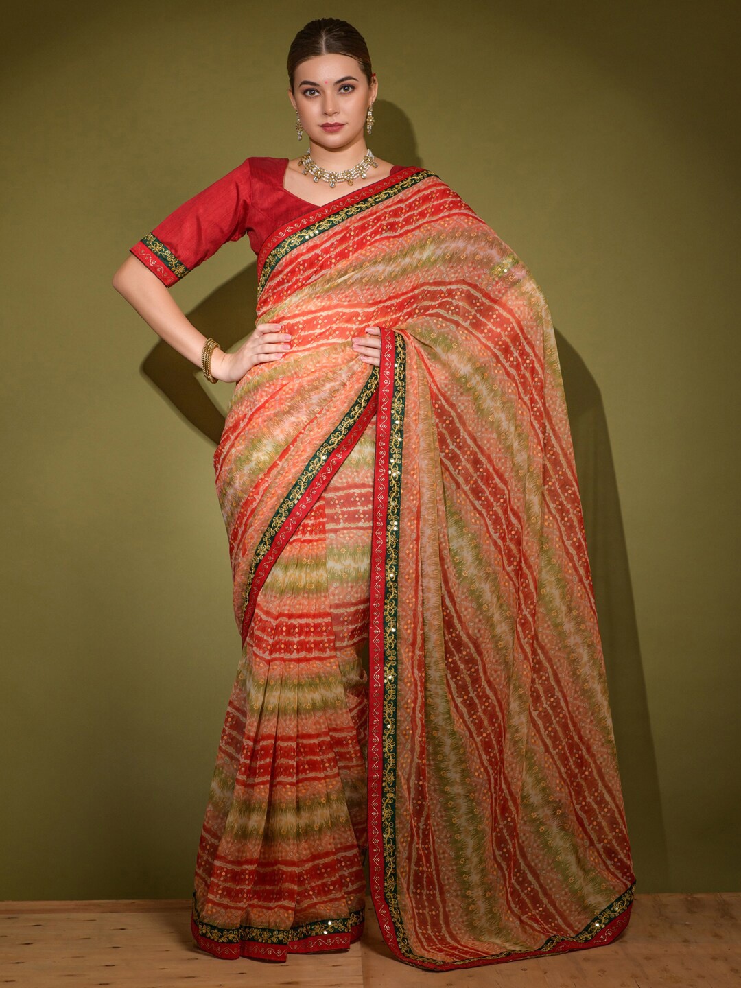 

Anouk Red & Green Striped Embroidered Border Pure Georgette Bagru Saree