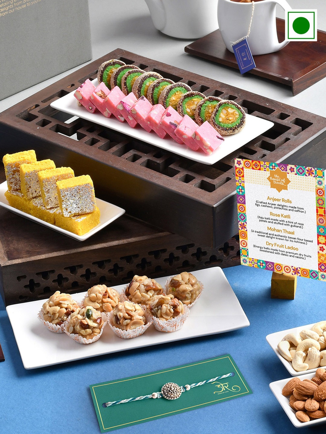 

RawFruit Round Charm Rakhis With Sweets Gifts Set-800gms, Blue