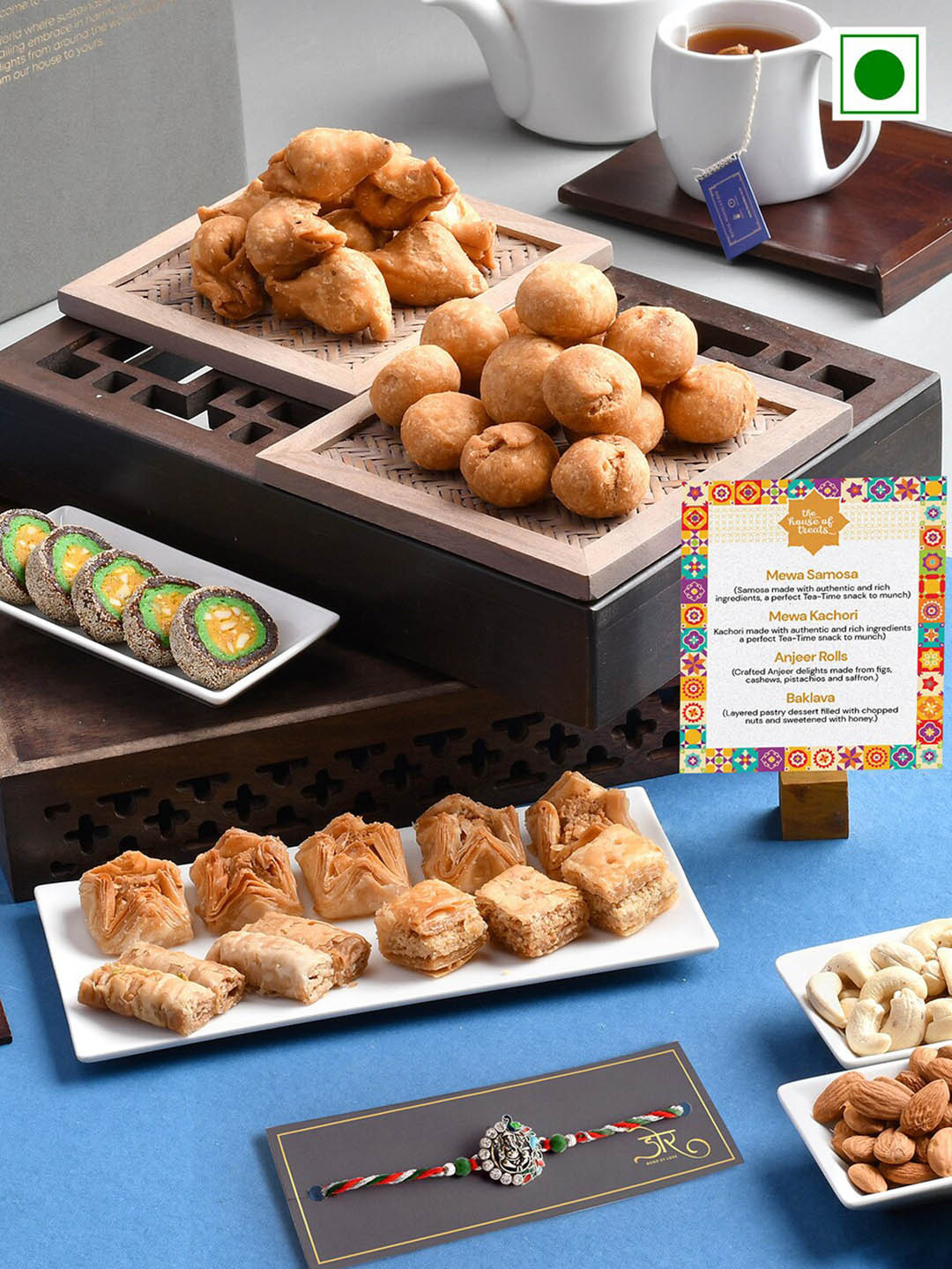 

RawFruit Ganesh Charm Rakhi With Roli Chawal & Sweets Savoury Set-200 gms Each, Silver