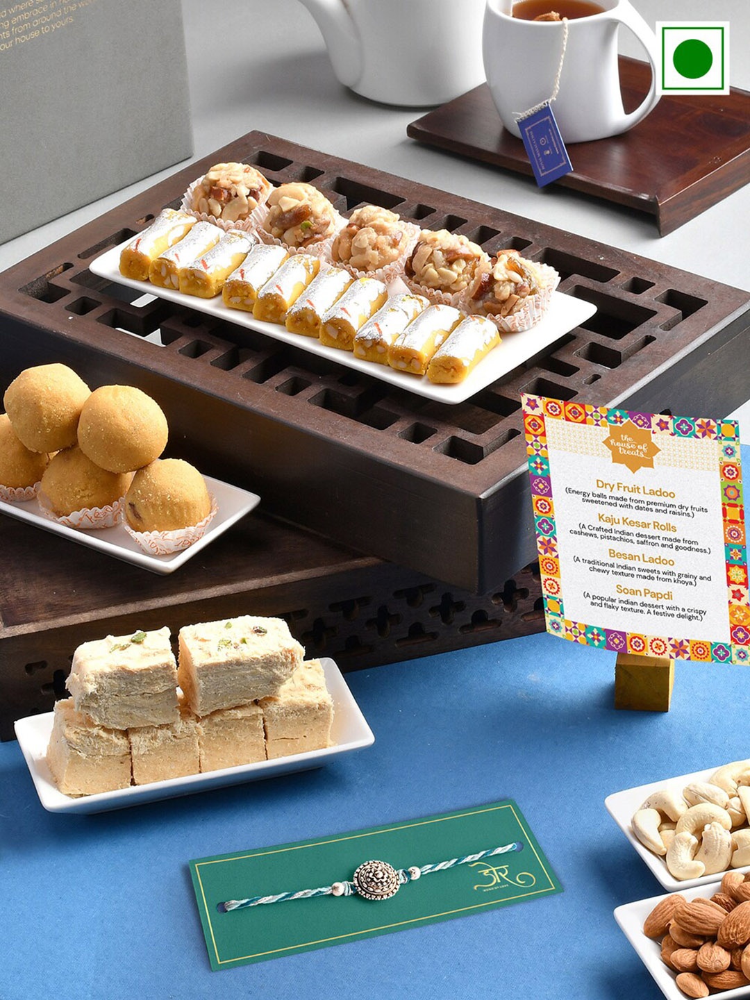 

RawFruit Intricare Textured Rakhi With Sweets Gift Set-800gms, Blue