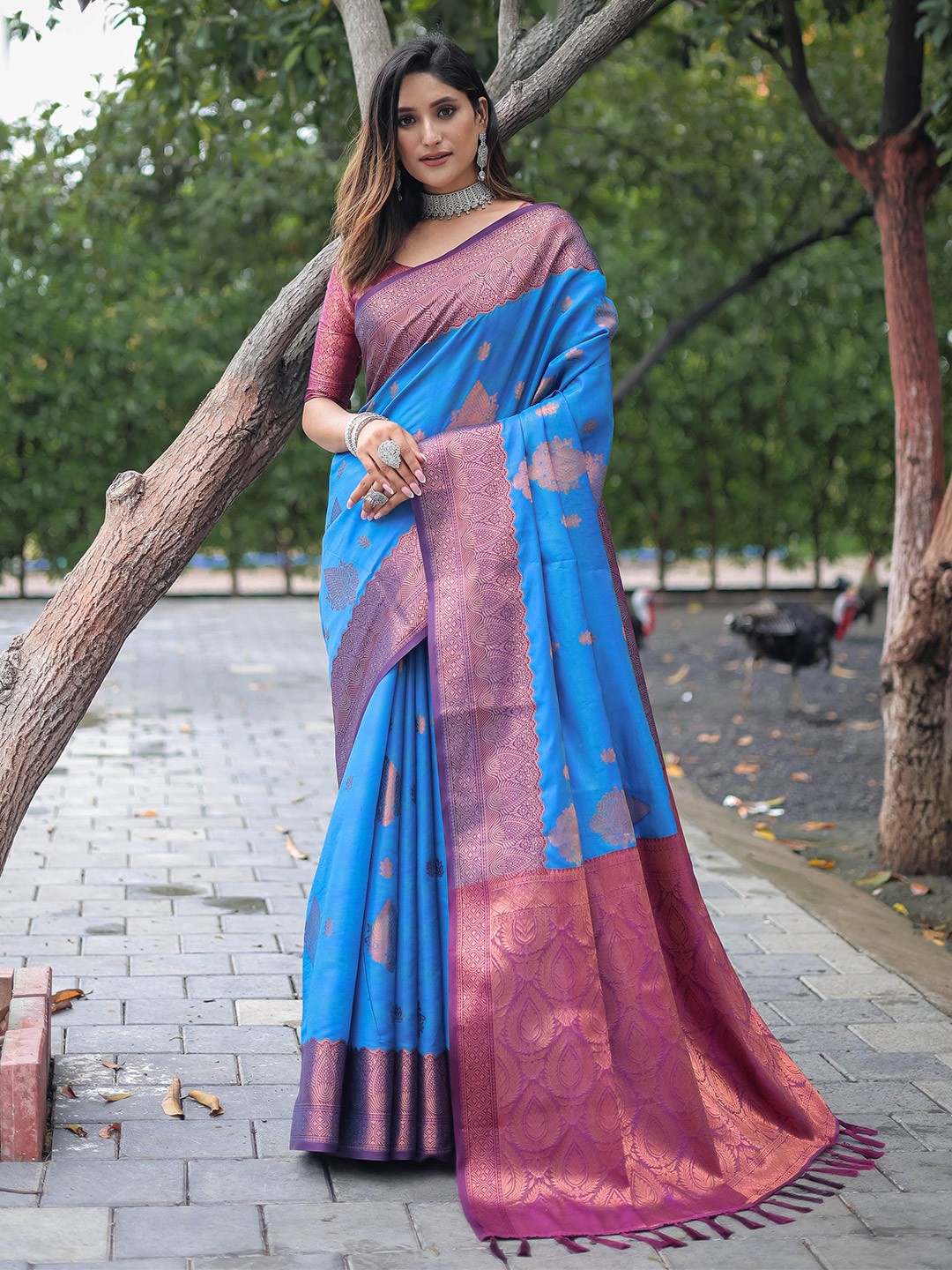 

Mitera Blue Ethnic Motifs Woven Design Zari Saree