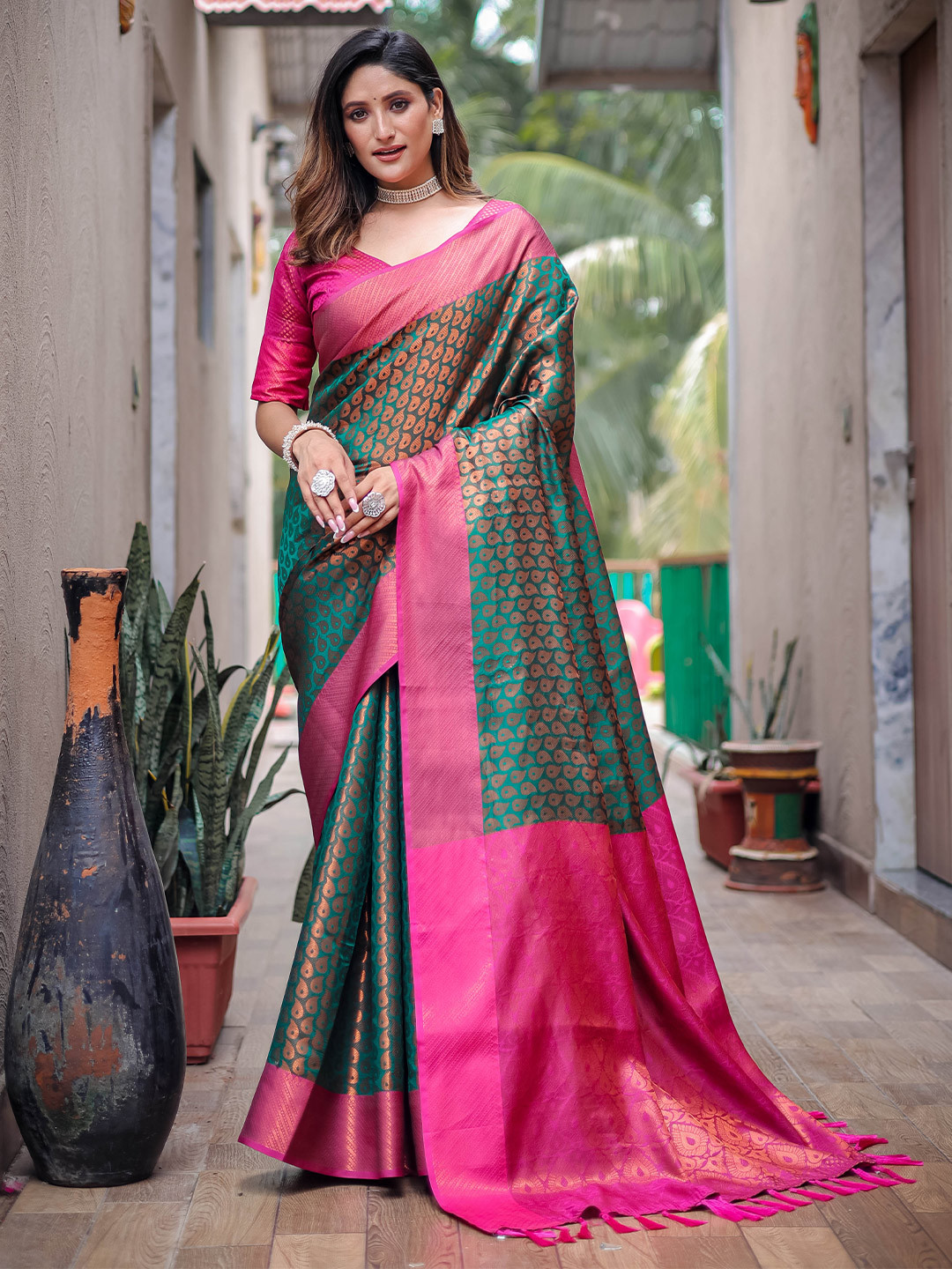 

Mitera Green Paisley Woven Design Zari Kanjeevaram Saree