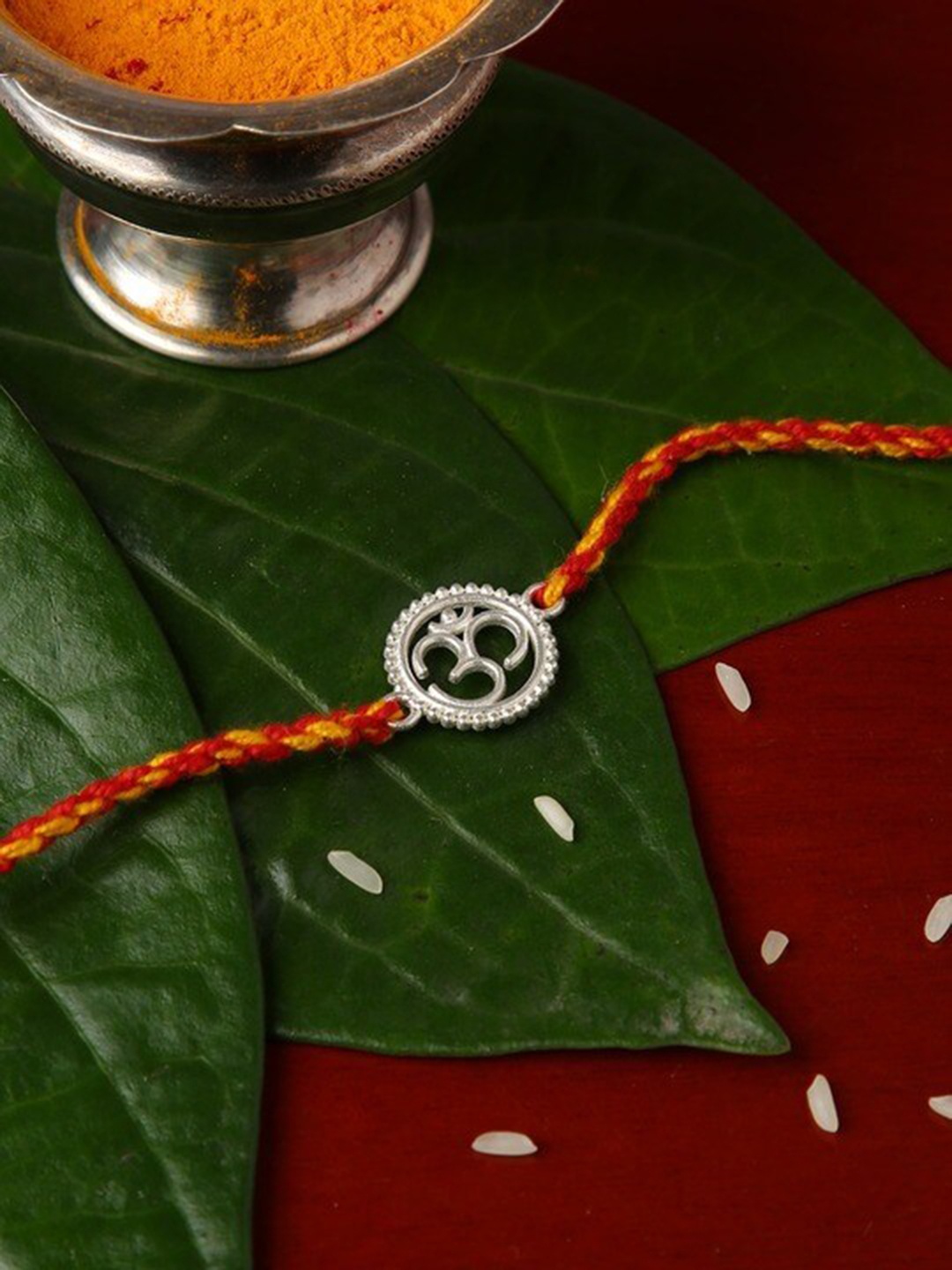 

justpeachy Om Circle Rakhi With Roli & Akshat, Silver