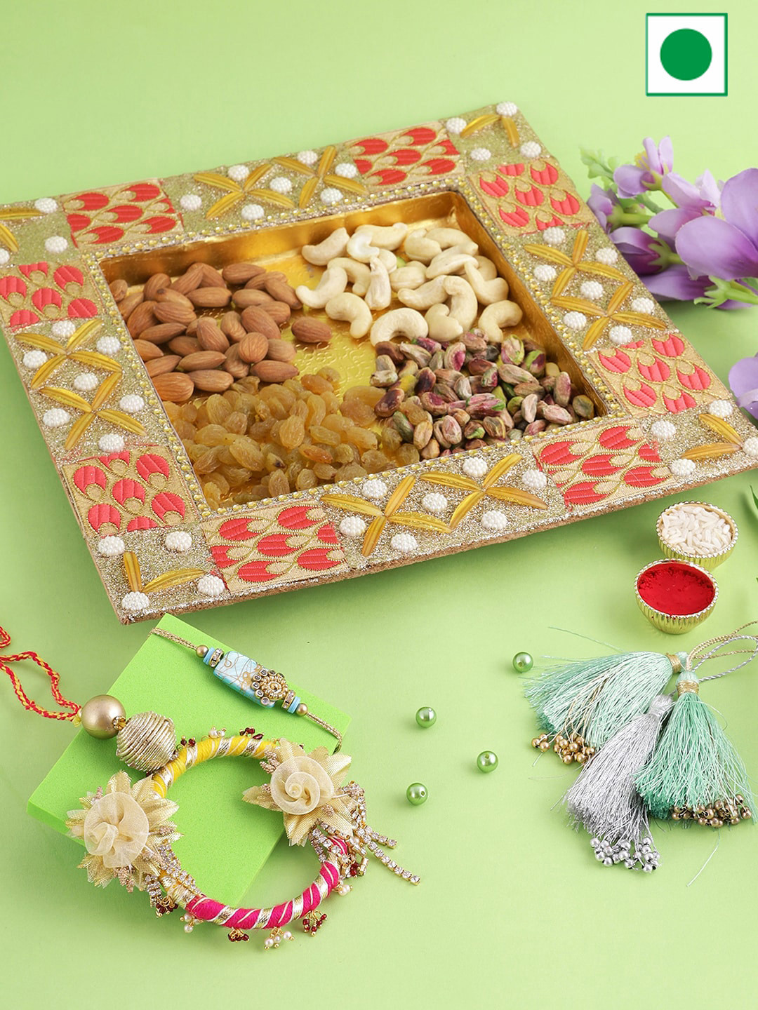 

Aapno Rajasthan Set Of 2 Stone Studded Rakhis With Wooden Tray Dryfruits Set-100 gms Each, Gold