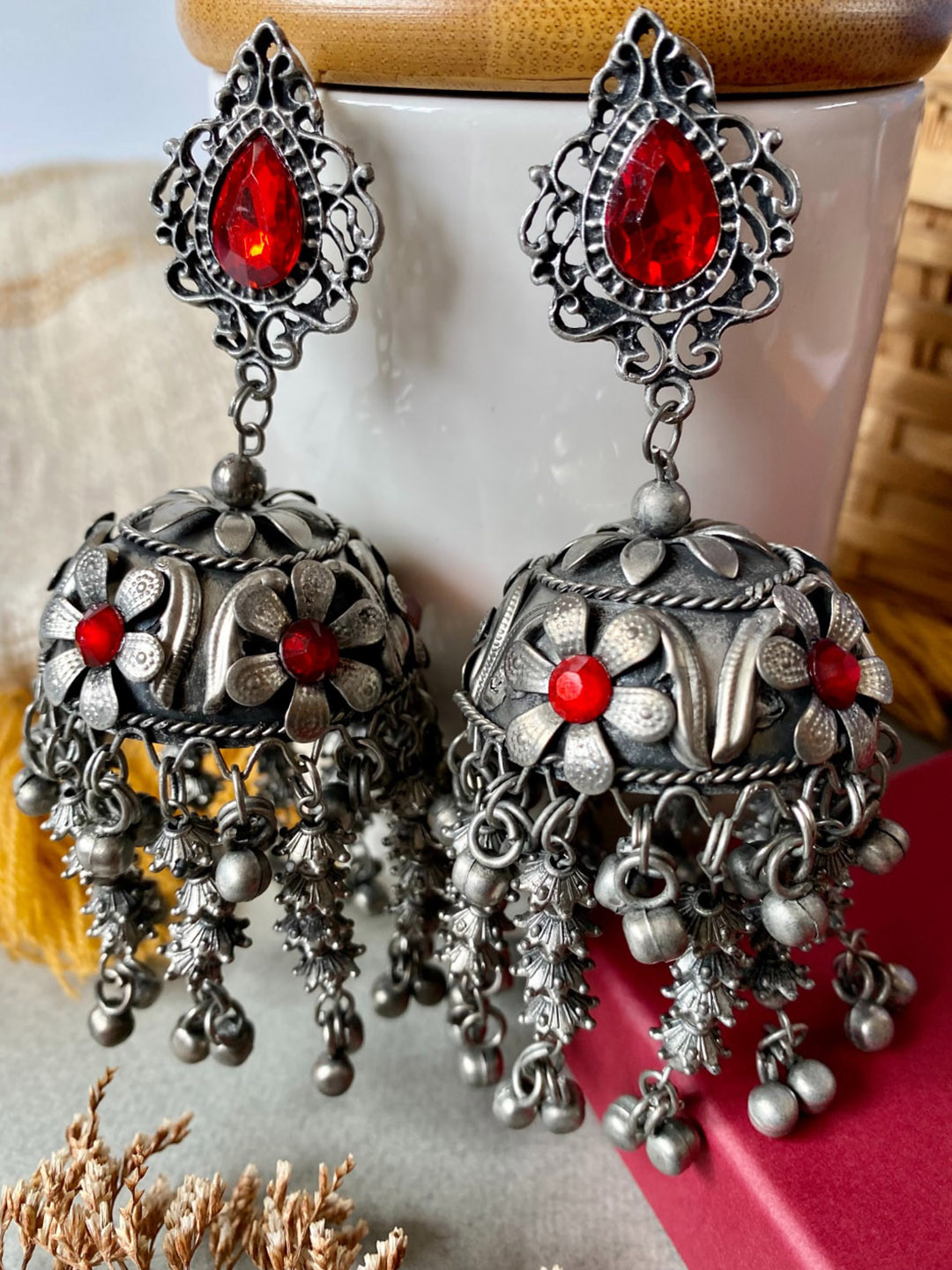 

Pihtara Jewels Silver-Plated Stone-Studded Oxidised Dome Shaped Jhumkas