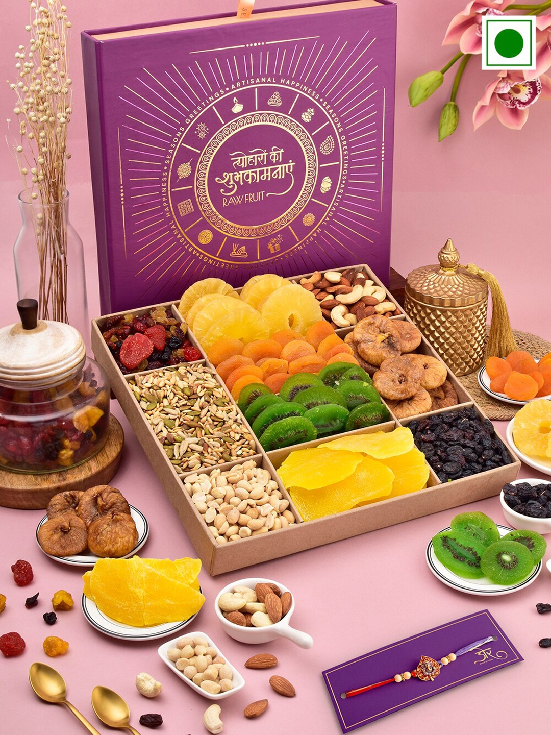 

RawFruit Ganesh Charm Rakhi With Roli Chawal & Tropical Nut Gift Set, Gold