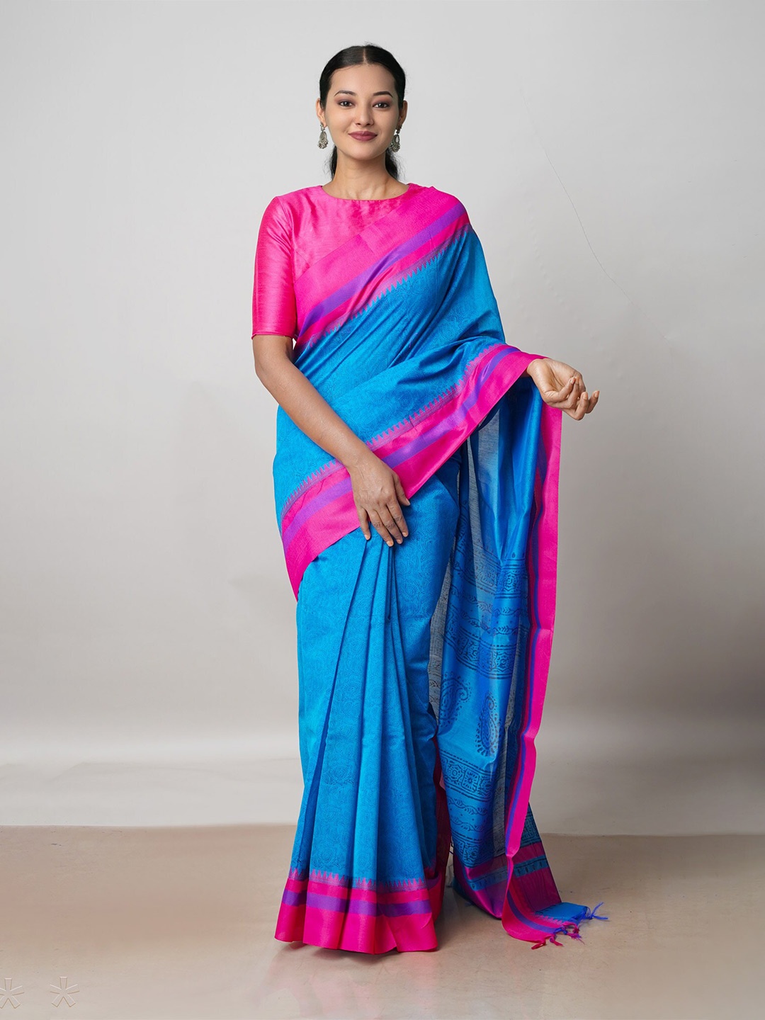 

Unnati Silks Blue & Pink Ethnic Motifs Silk Cotton Baluchari Saree