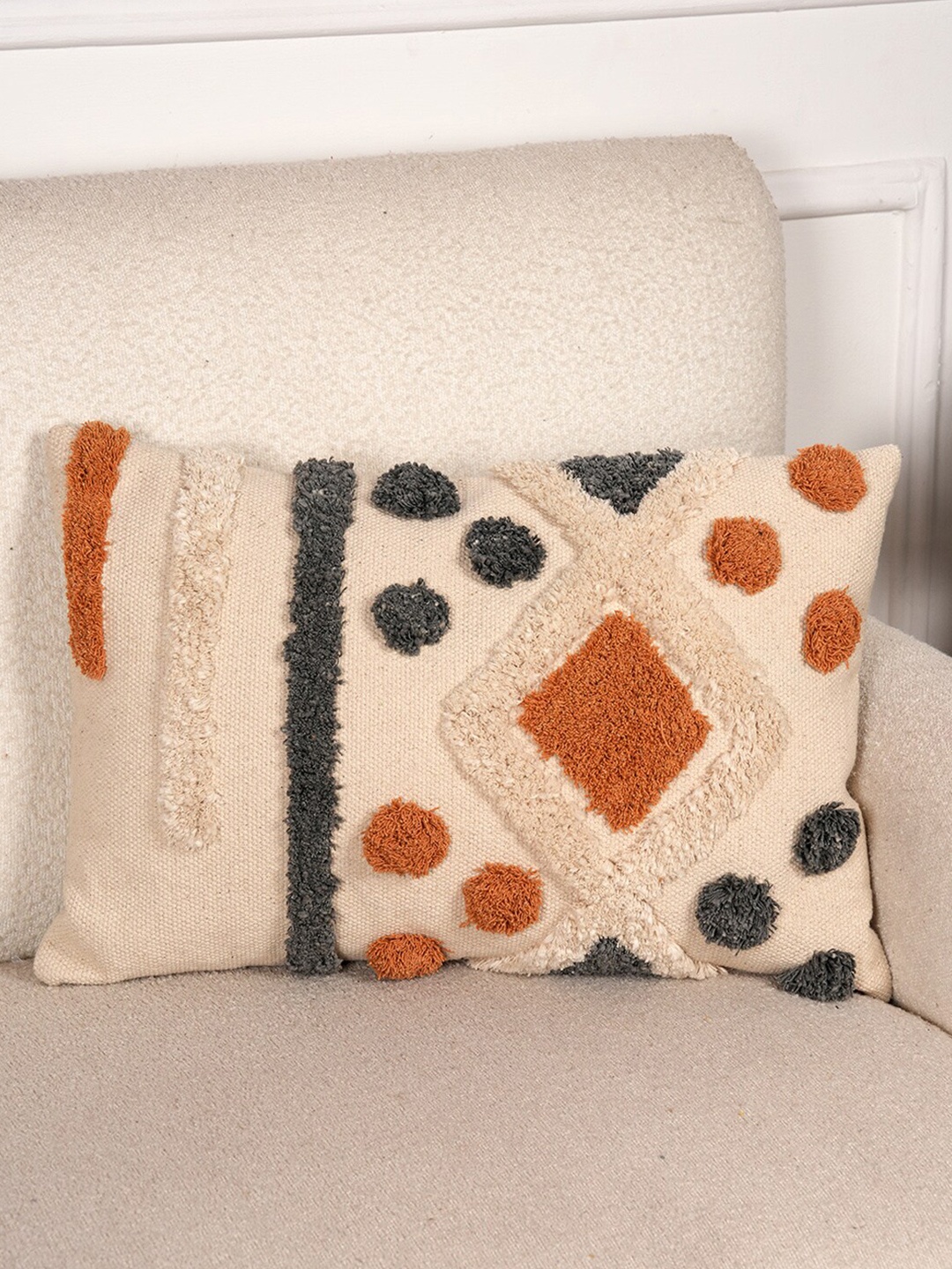 

Art Avenue Cream & Orange Self Design Cotton Rectangle Cushion Cover
