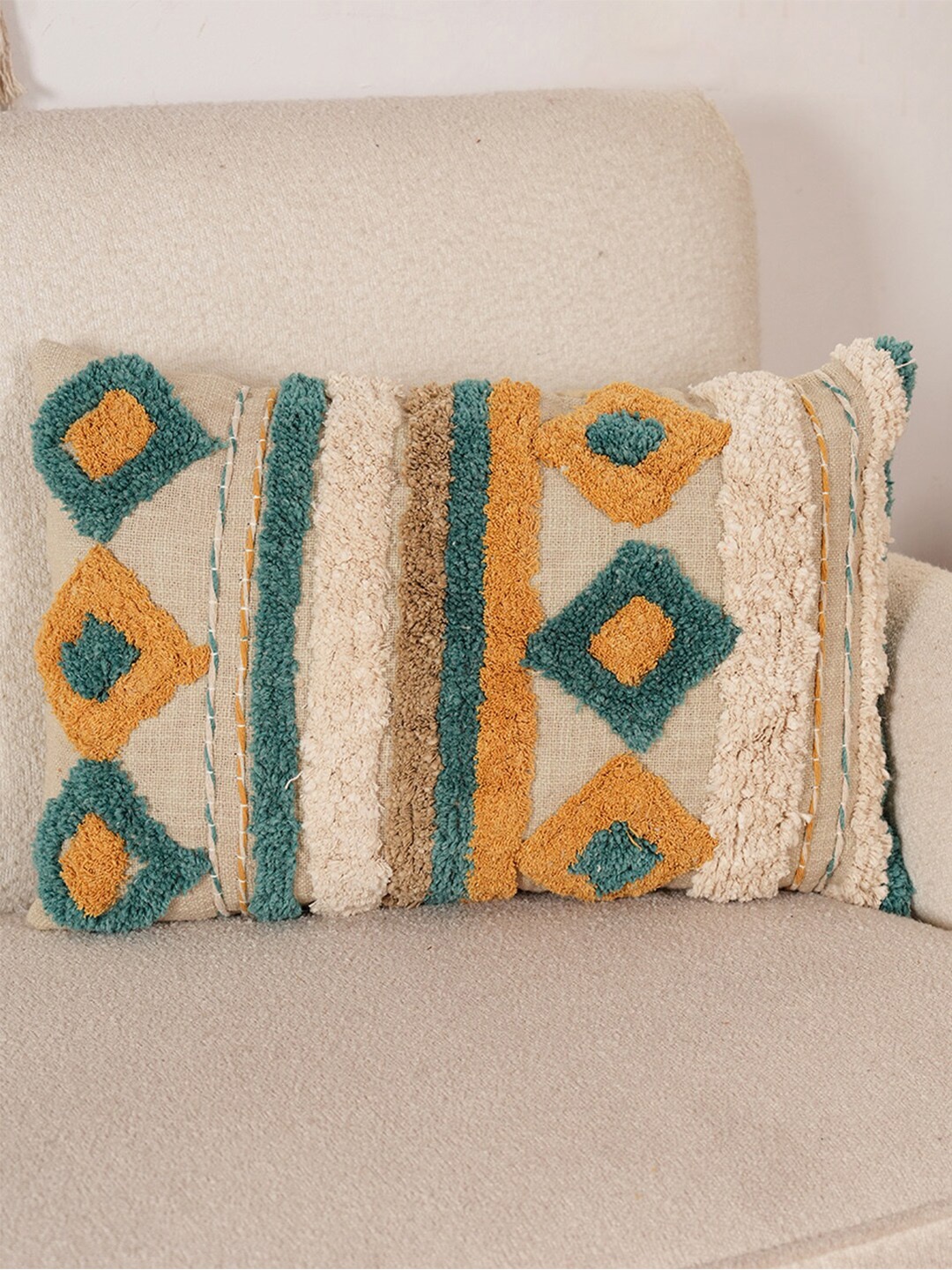 

Art Avenue Off White & Orange Self Design Cotton Rectangle Cushion Cover