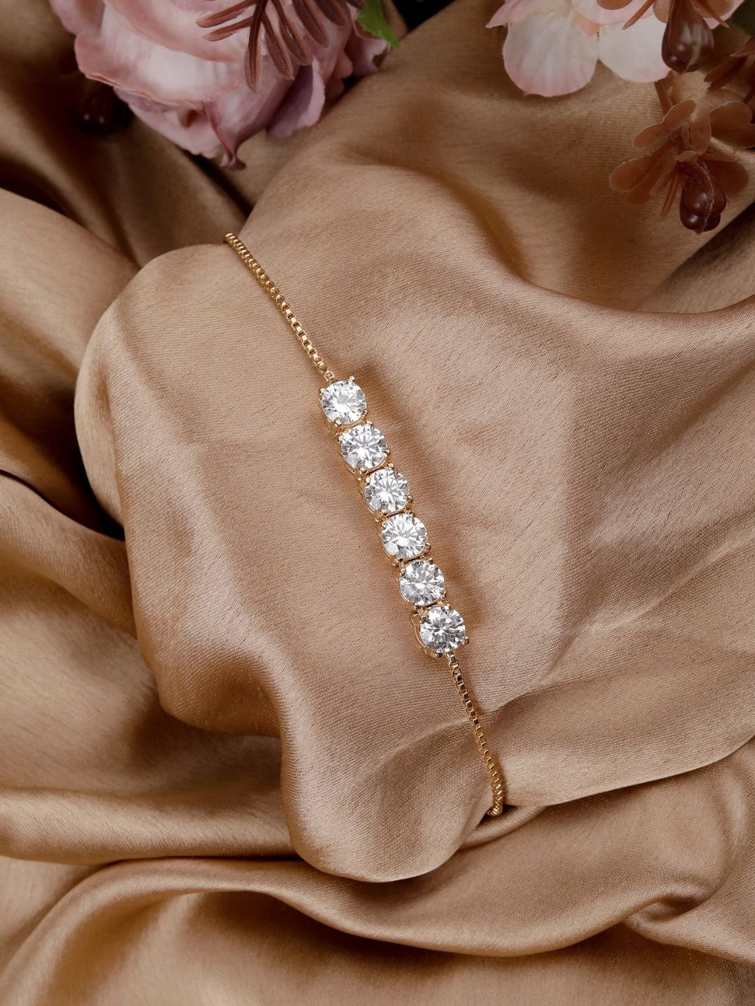 

AccessHer Women Gold Plated American Diamond Studded Charm Bracelet