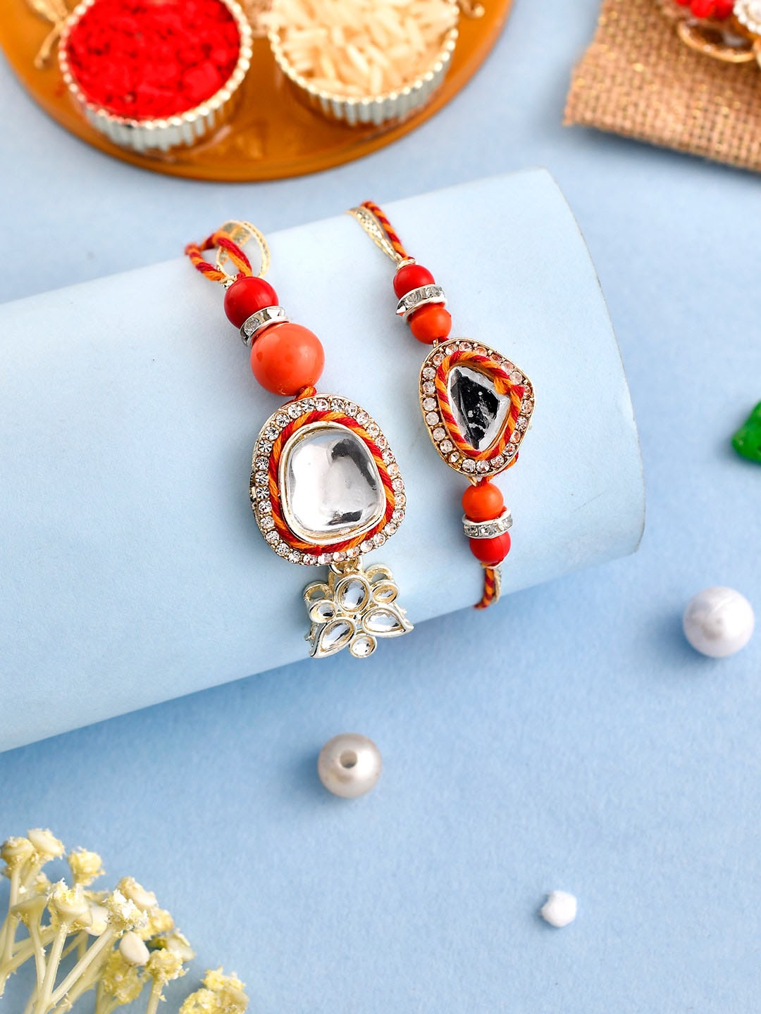 

Aapno Rajasthan Unisex Set Of 2 Rakhis With Roli Chawal & Greeting Card, Red