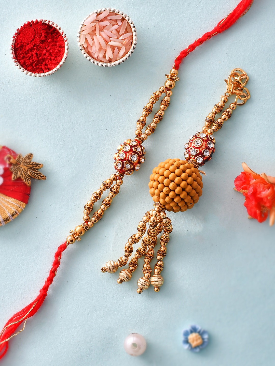 

Aapno Rajasthan Unisex Set Of 2 Beaded Rakhi With Roli Chawal & Greeting Card, Gold