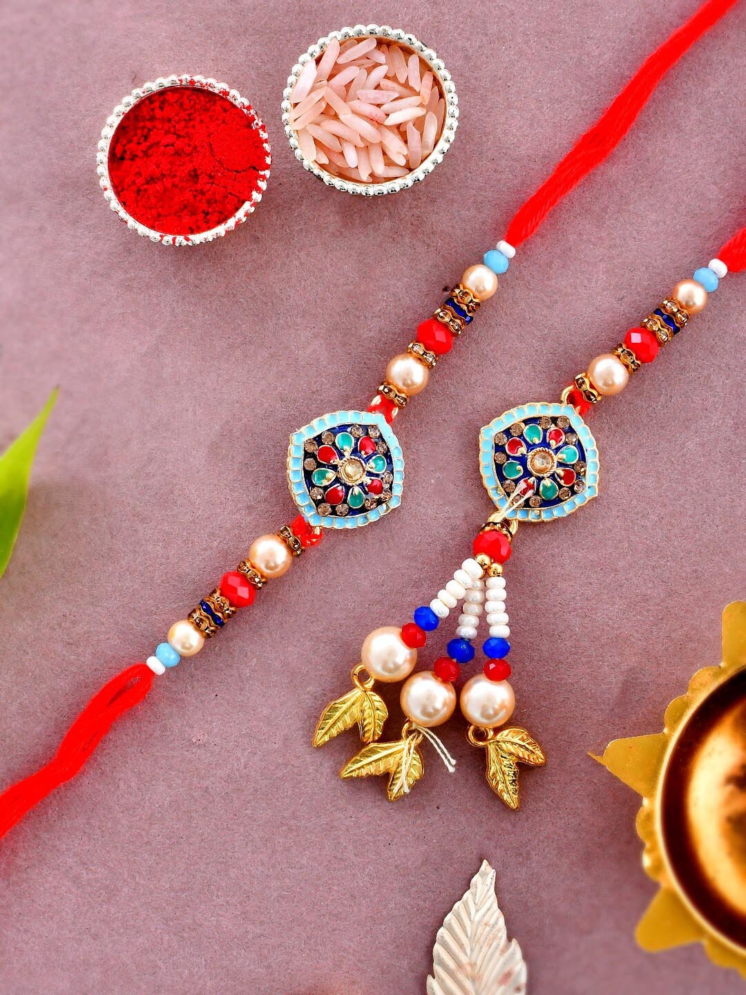 

Aapno Rajasthan Set Of 2 Bhaiya Bhabhi Rakhi With Roli Chawal & Greeting Card, Gold