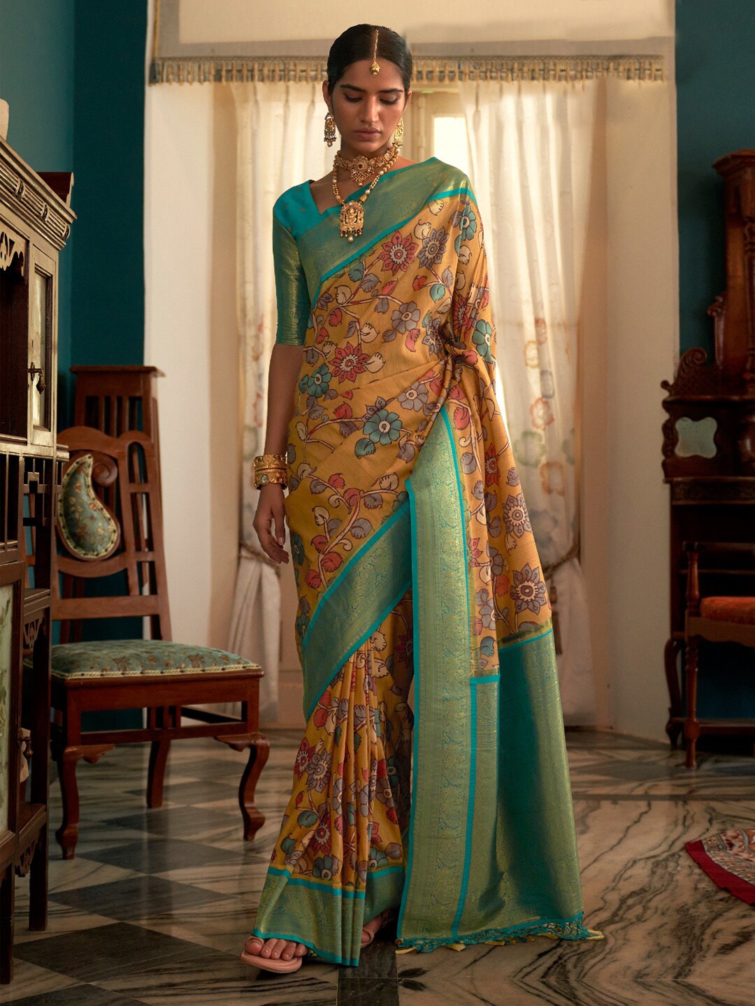 

Mitera Mustard & Green Kalamkari Printed Zari Banarasi Saree