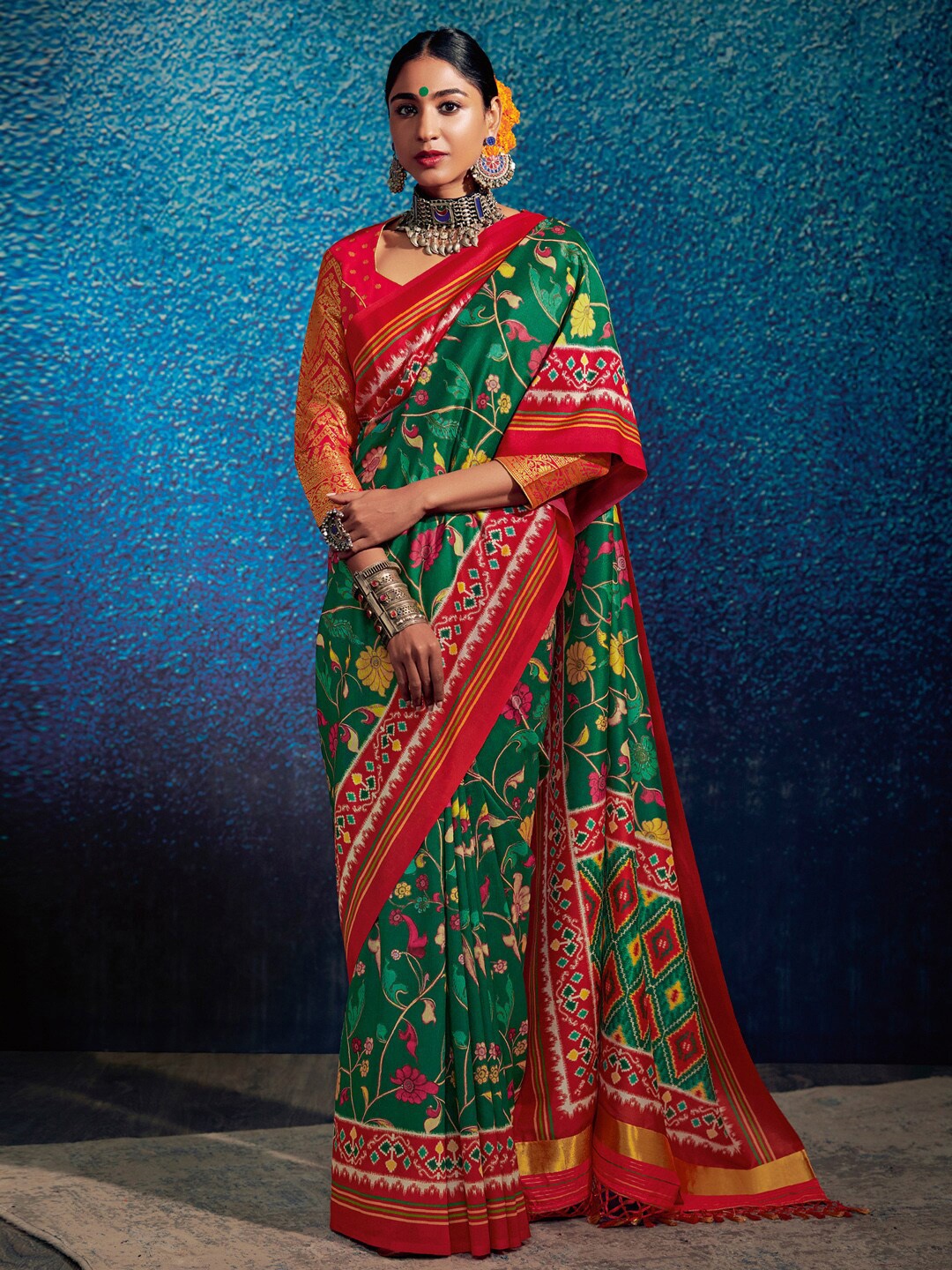 

Mitera Green & Red Ethnic Motifs Silk Blend Ikat Saree