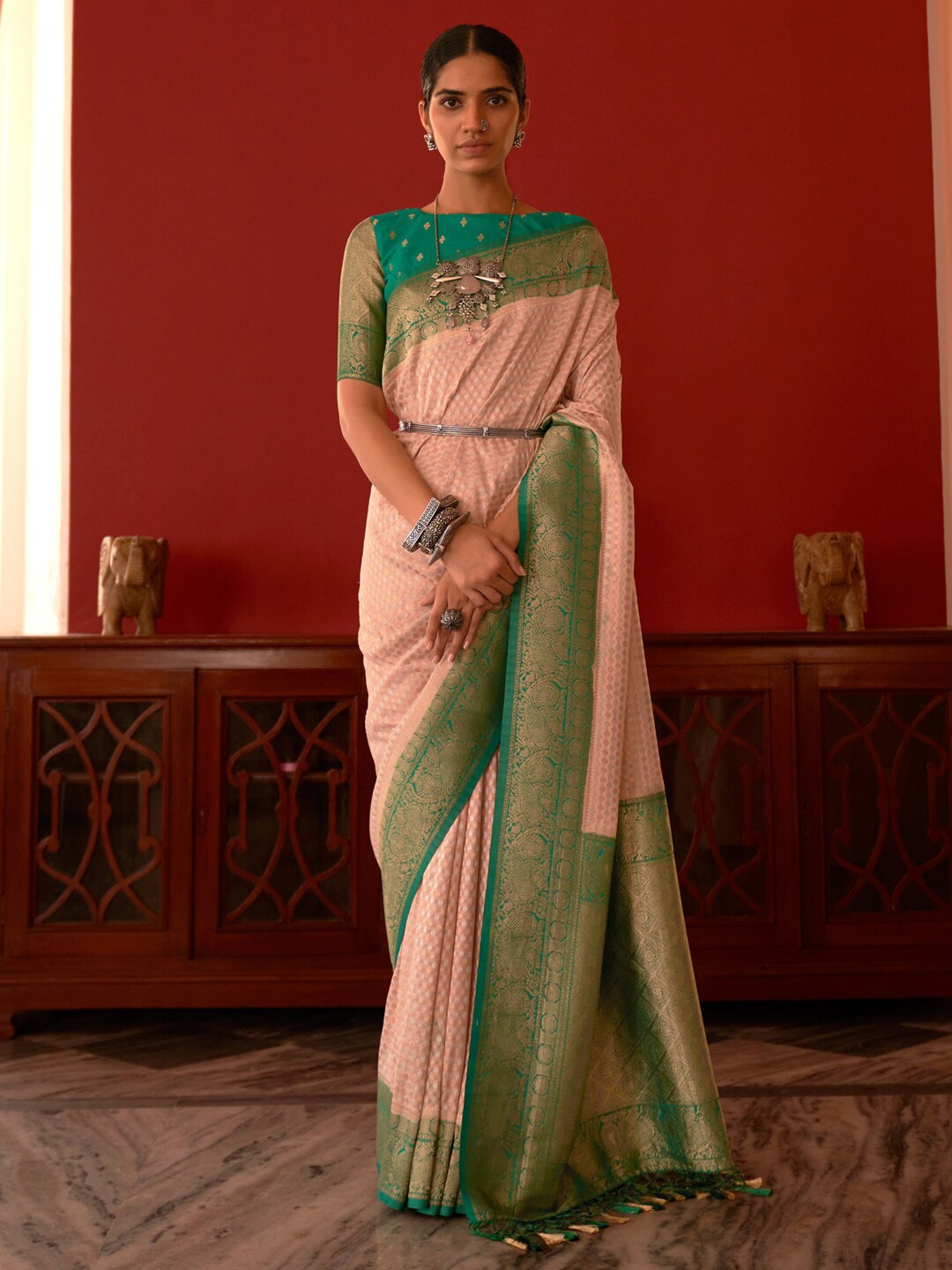 

Mitera Rose Gold & Green Floral Woven Design Zari Silk Blend Kanjeevaram Saree