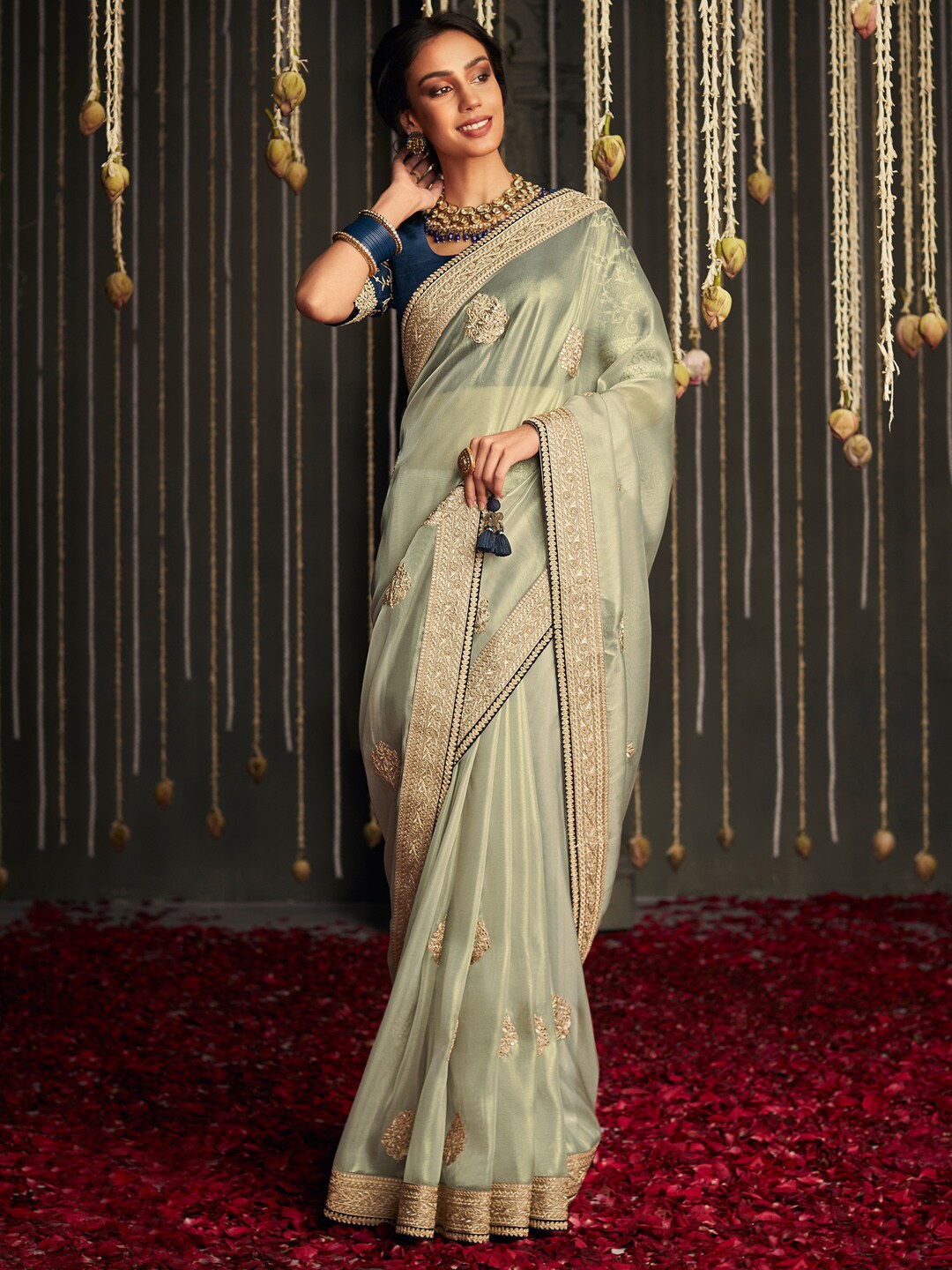 

Mitera Green & Blue Embellished Embroidered Silk Blend Saree
