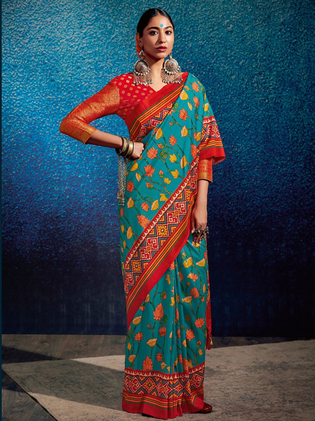 

Mitera Blue & Red Floral Silk Blend Ikat Saree