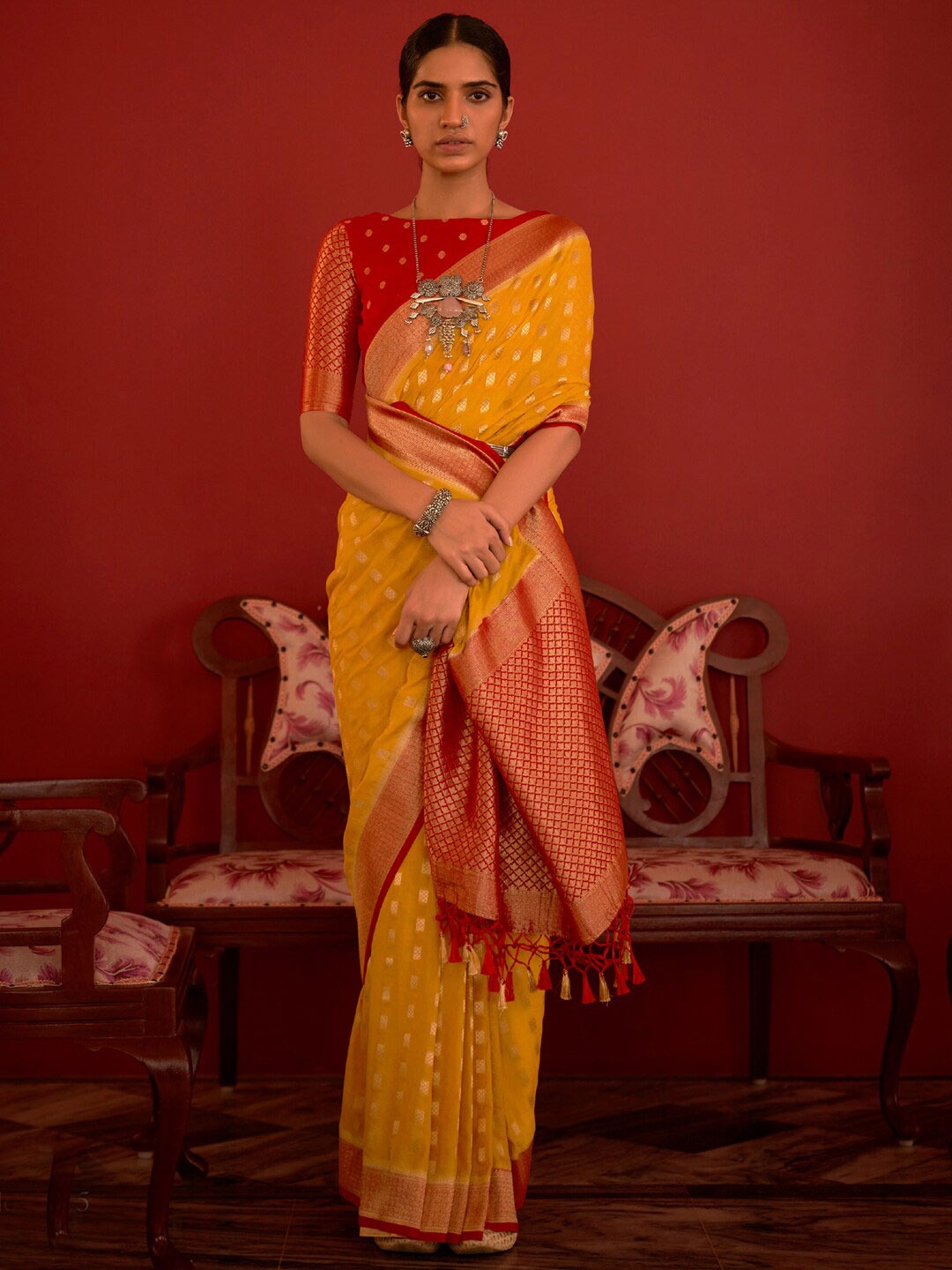

Mitera Yellow & Red Floral Woven Design Zari Silk Blend Kanjeevaram Saree