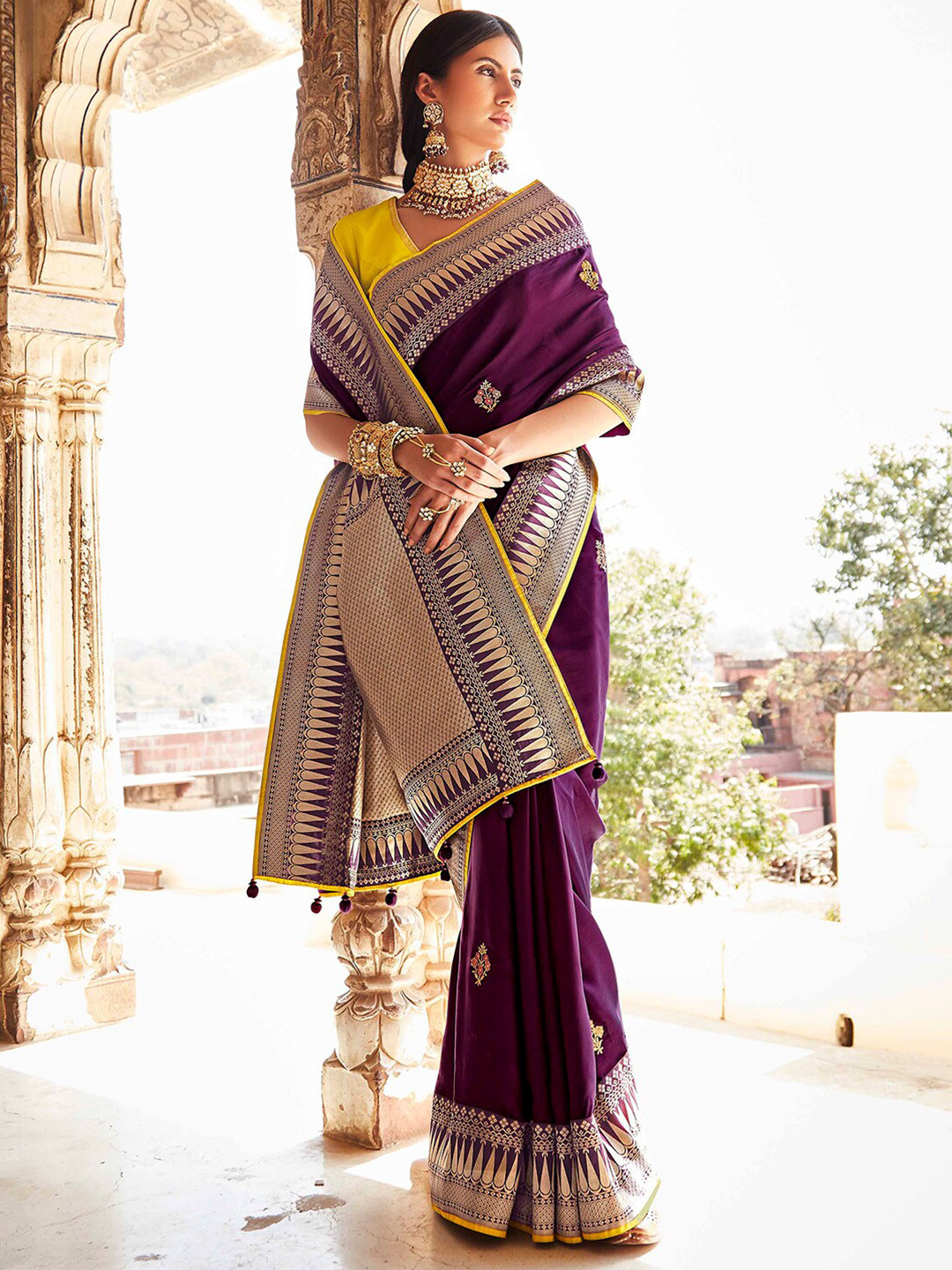 

Mitera Purple & Yellow Floral Zari Silk Blend Banarasi Saree