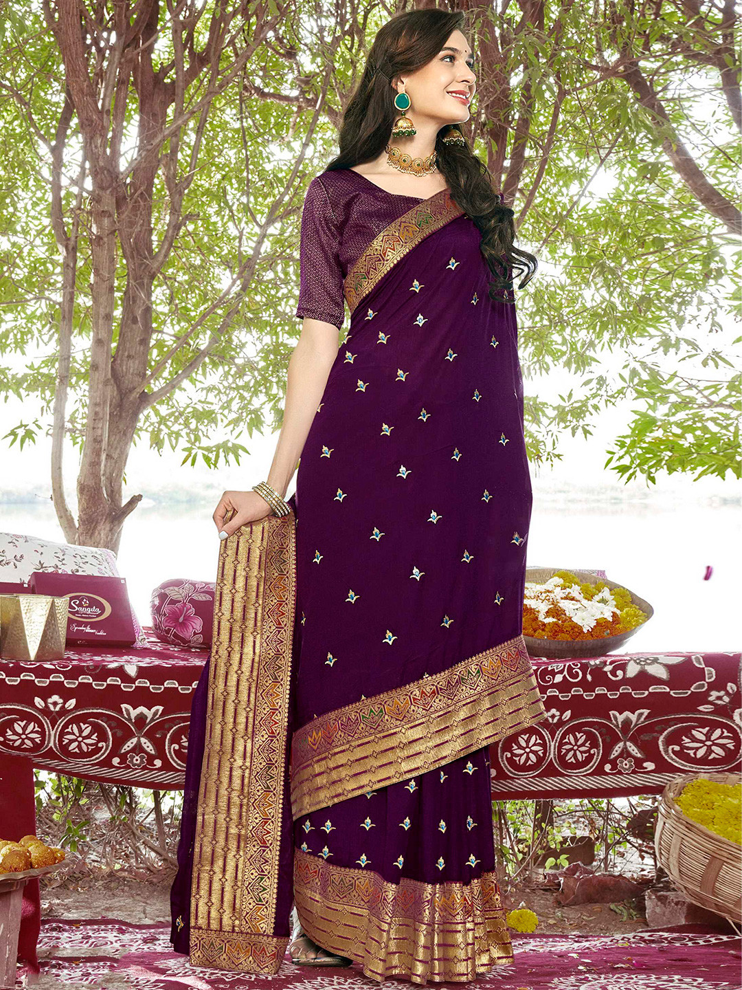 

Mitera Purple & Blue Ethnic Motifs Embroidered Zari Saree